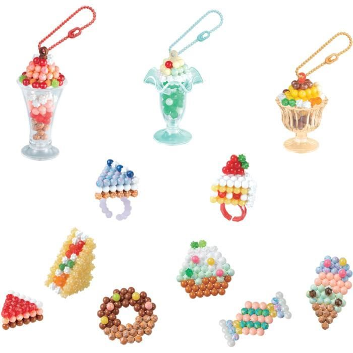Llaveros y anillos de cuentas coloridas con forma de dulces, helados y pasteles.
