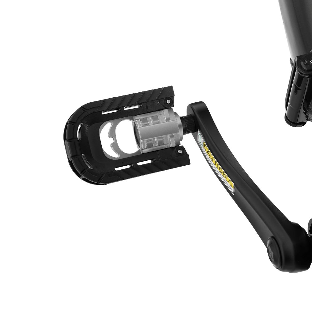 Pedale bicicletta nero con centro argento su sfondo bianco. Etichetta di avvertenza visibile.