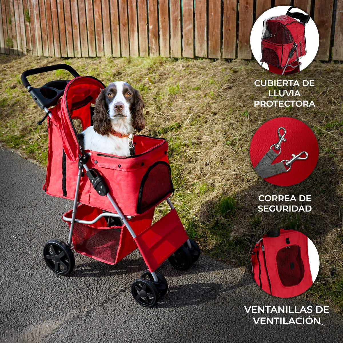 Un perro marrón y blanco sentado en un cochecito rojo para mascotas al aire libre. Incluye funda, correa y ventilación.