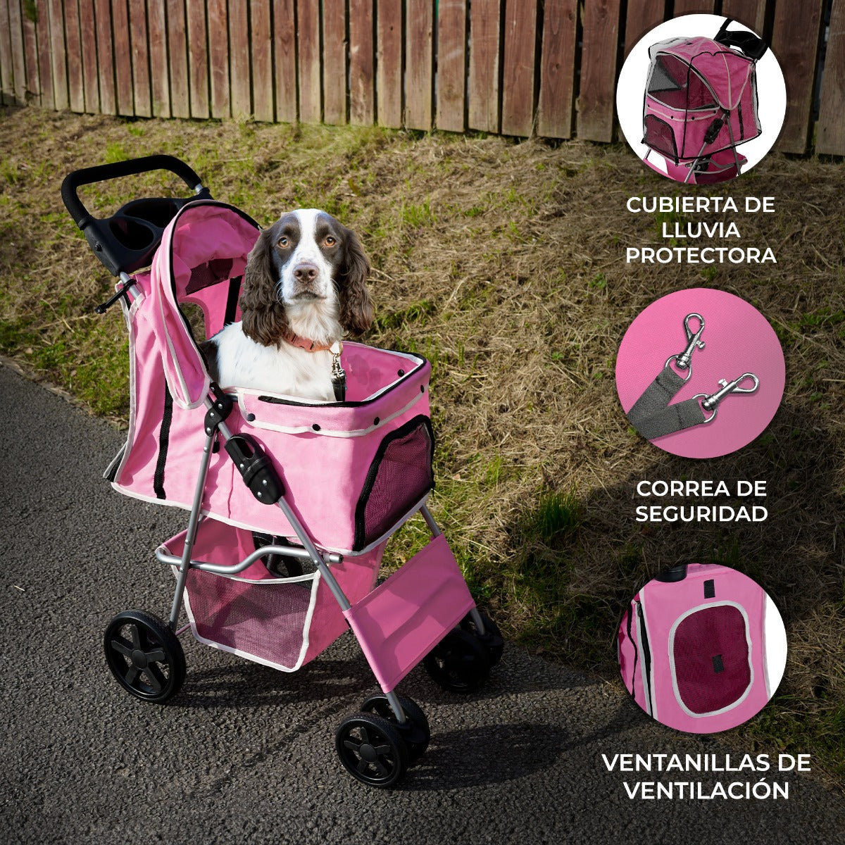 Un perro sentado en un cochecito rosa con una valla de madera de fondo.