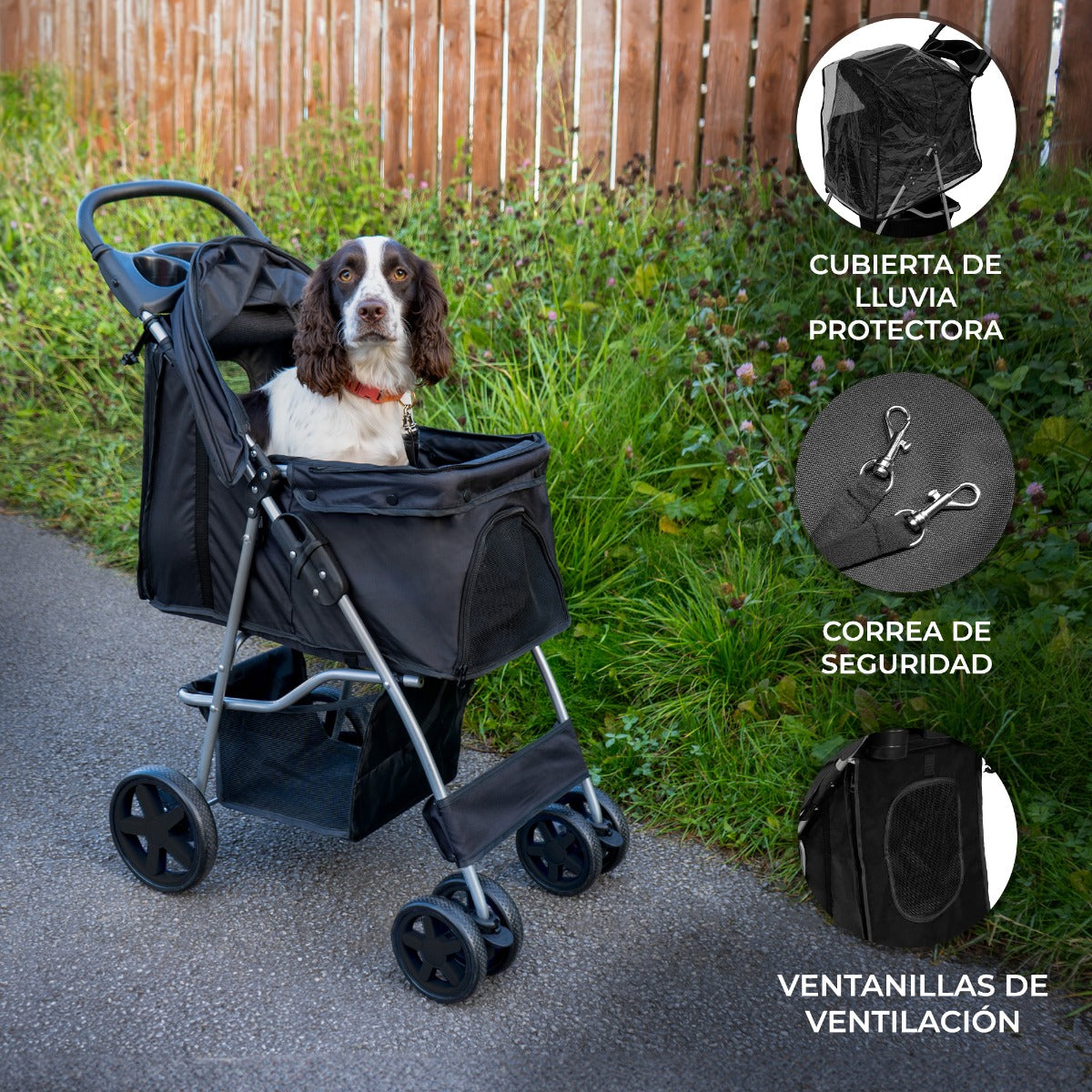 Un perro en un cochecito negro con ventanas de malla y valla de madera.