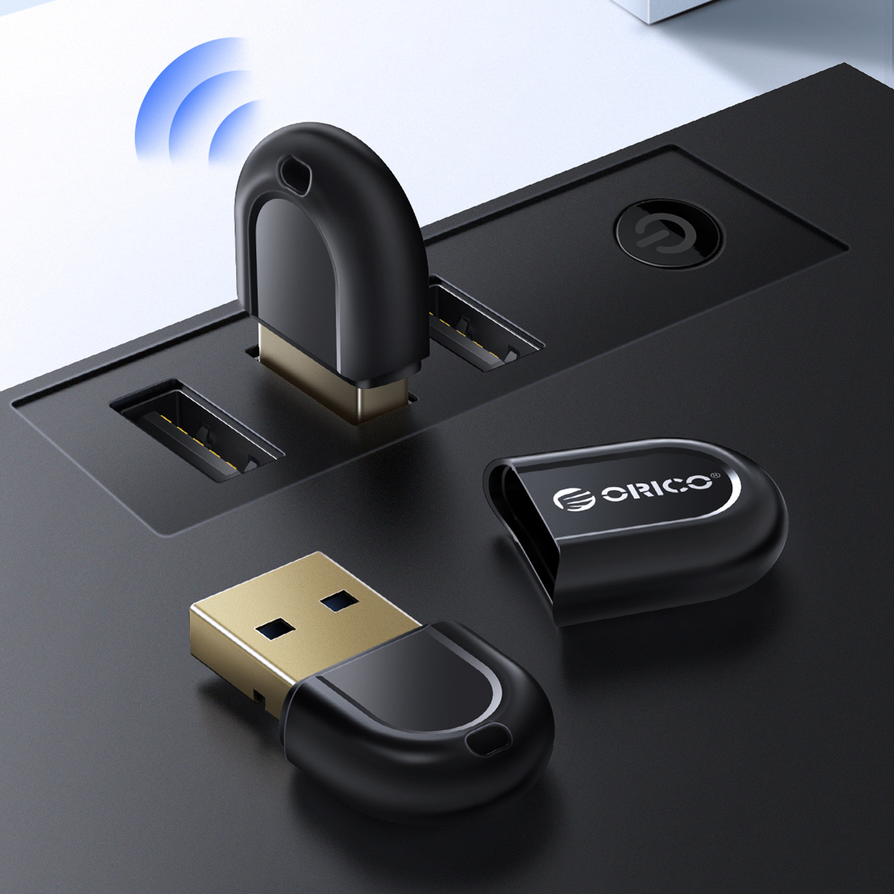 Dwa czarne adaptery USB, jeden w czarnym hubie, z symbolem Wi-Fi.