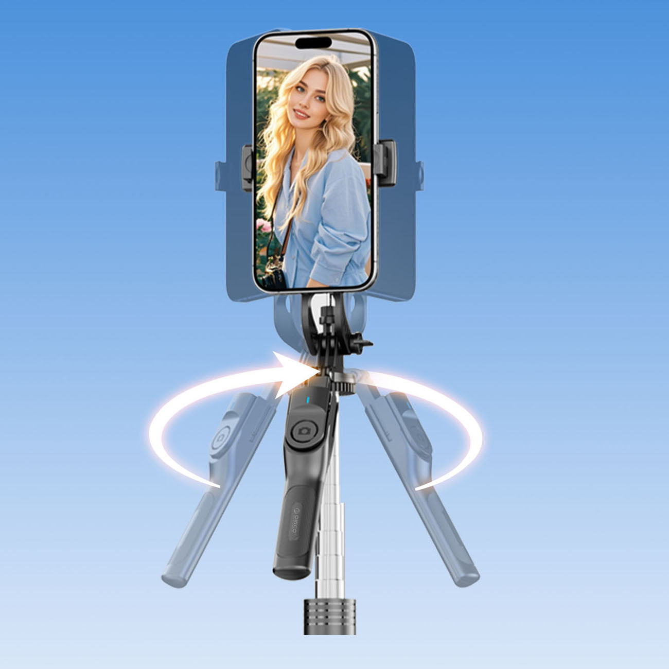Smartfon trzyma kobietę stojącą na obrotowym kijku do selfie.