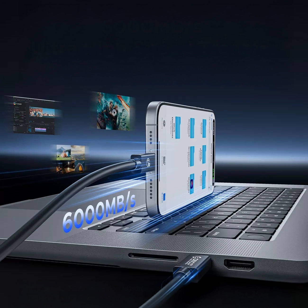 Uno smartphone è collegato a un laptop tramite cavo, visualizzando 6000 MB/s.