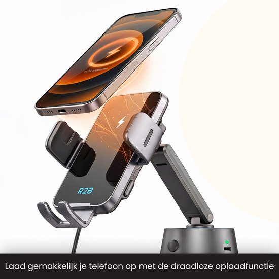 Een smartphone laadt draadloos op een houder, met een tweede telefoon op de achtergrond.