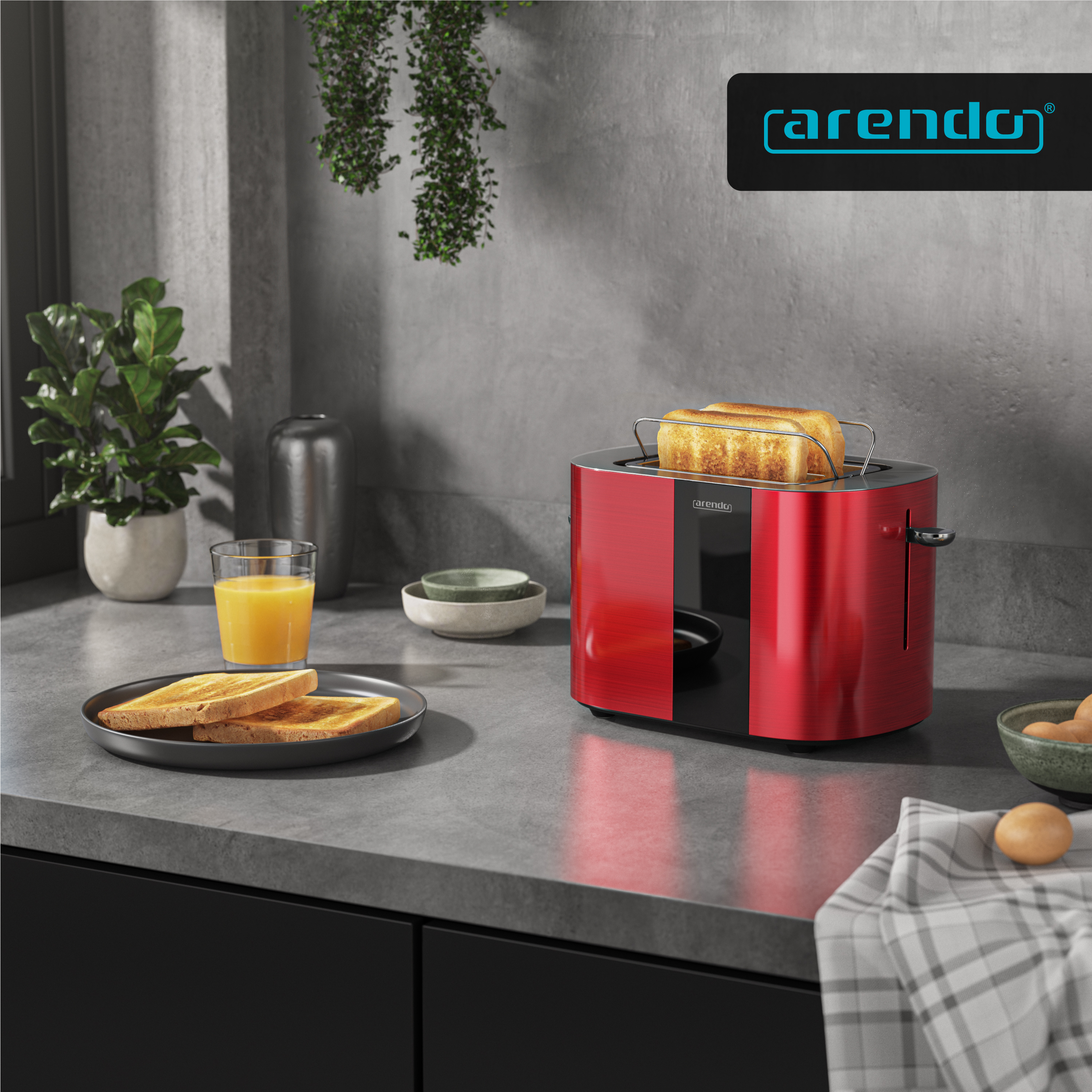 Ein roter Toaster mit Toastbrot, Orangensaft und Eiern auf einer Küchenarbeitsplatte.