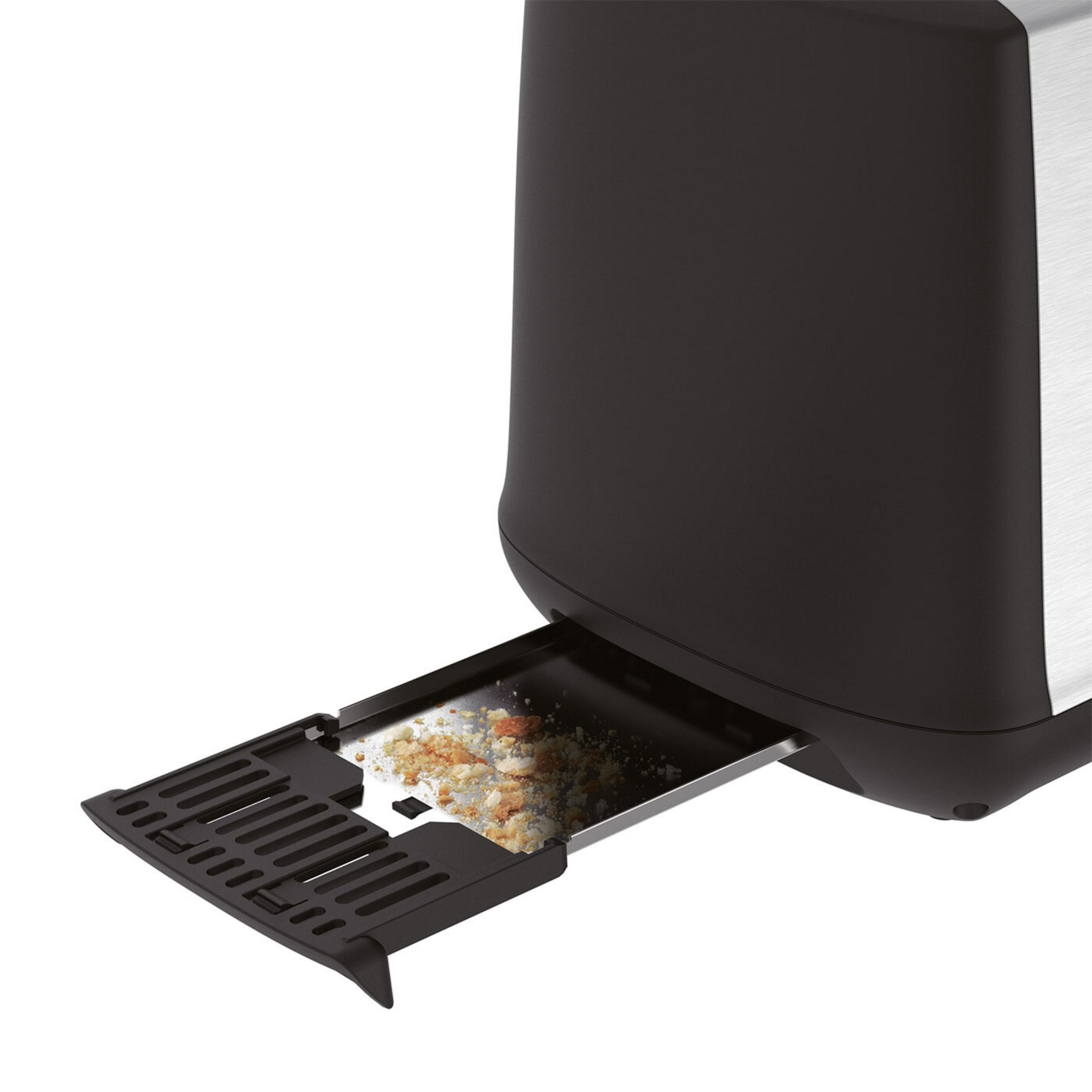 Ein Toaster mit herausgezogener Krümelschublade voller Krümel.