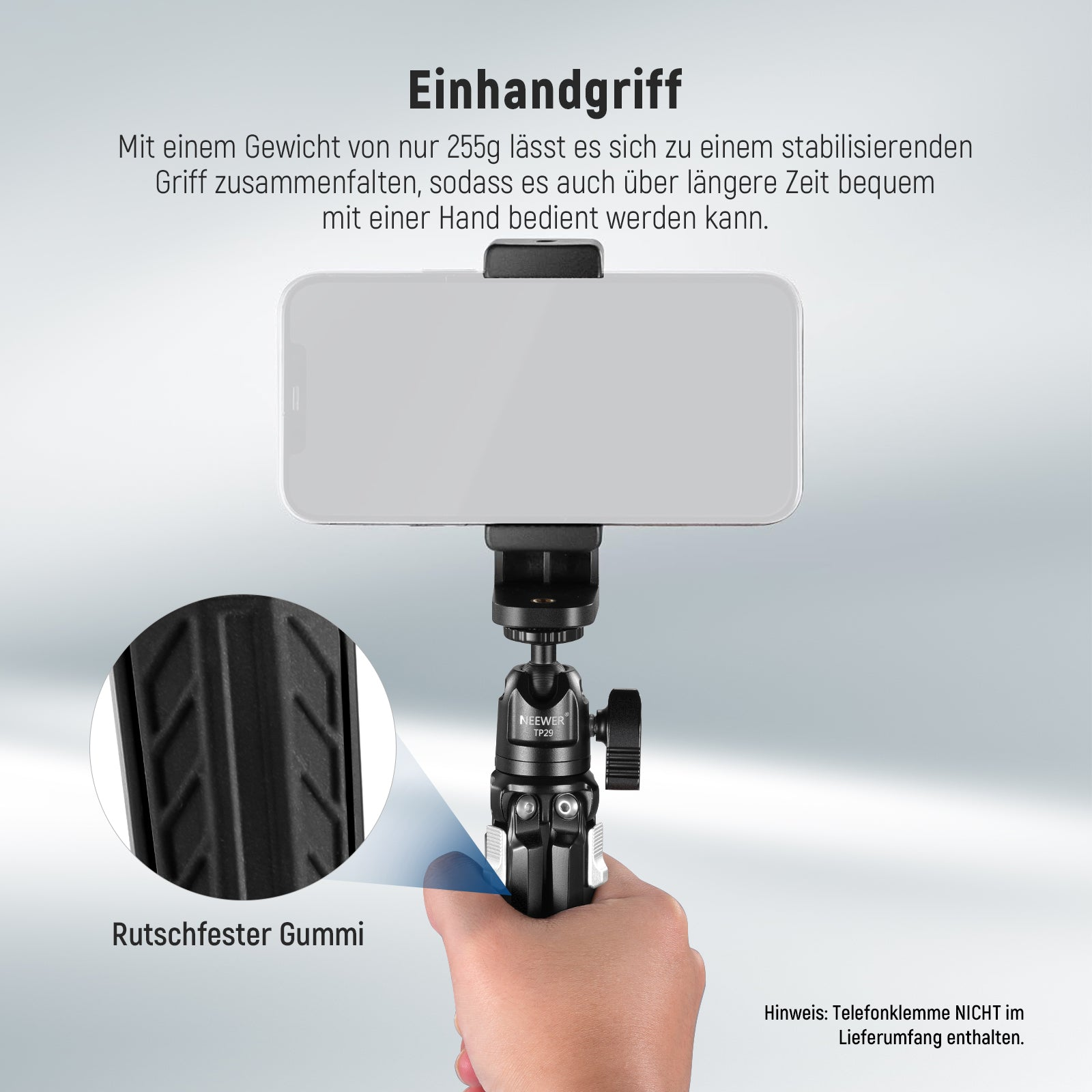 Eine Hand hält einen leichten, faltbaren Kameragriff mit Smartphone-Halterung.