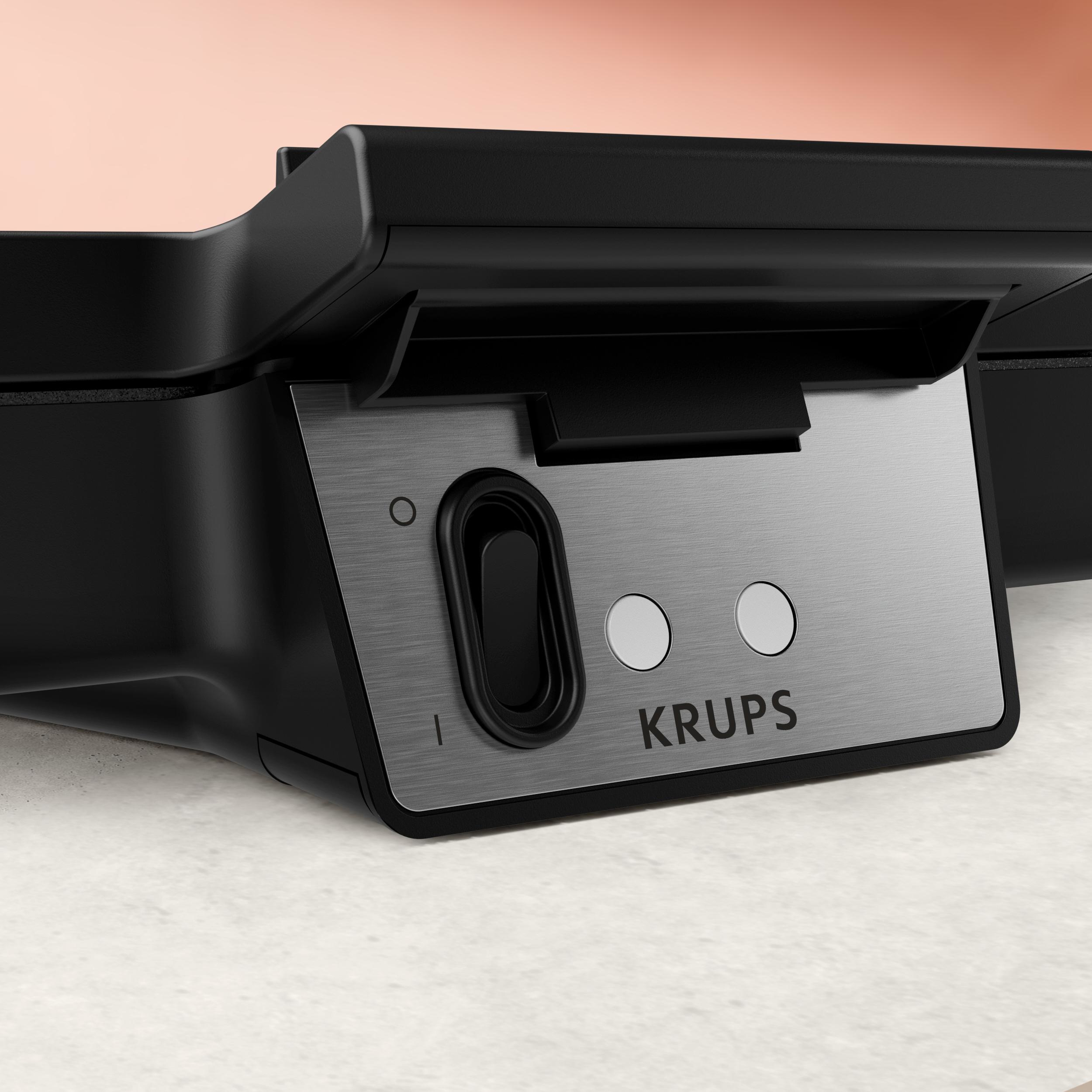 Una bistecchiera Krups nera con placca argento e pulsanti.