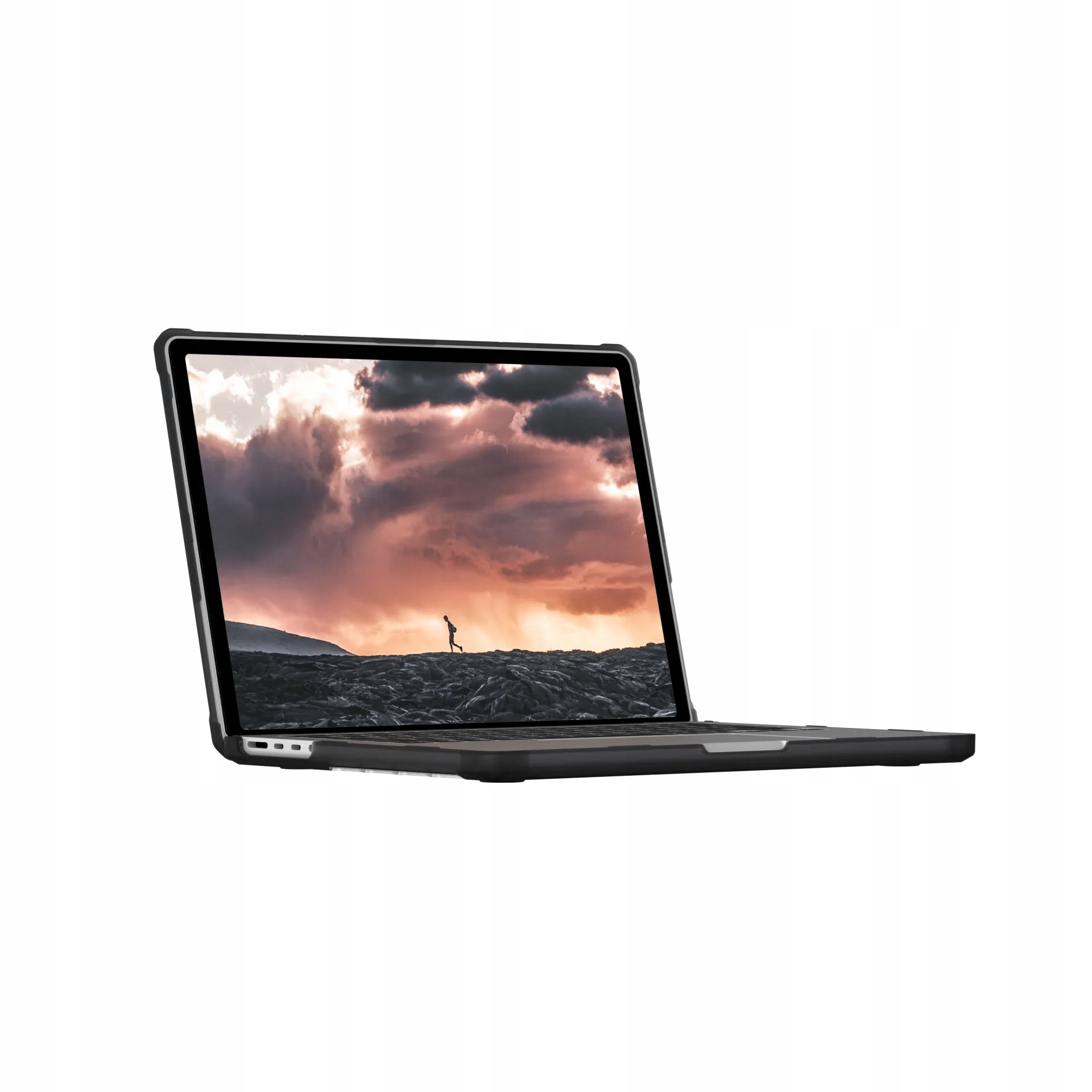 Un laptop aperto mostra un uomo che corre su un paesaggio roccioso contro un cielo drammatico.