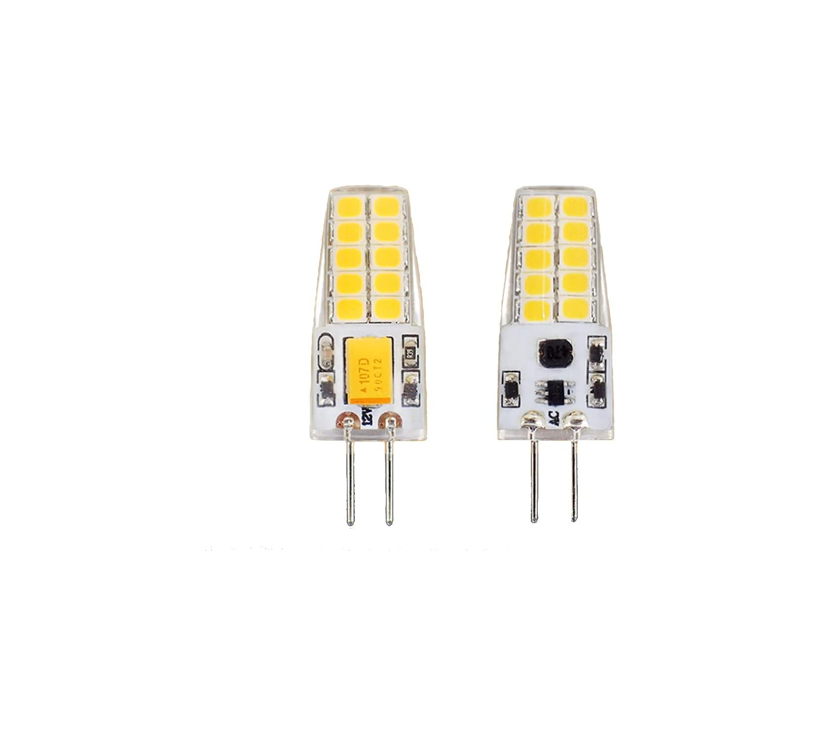 Zwei weiße LED-Lampen mit Stiften, eine mit Beschriftung 12V.