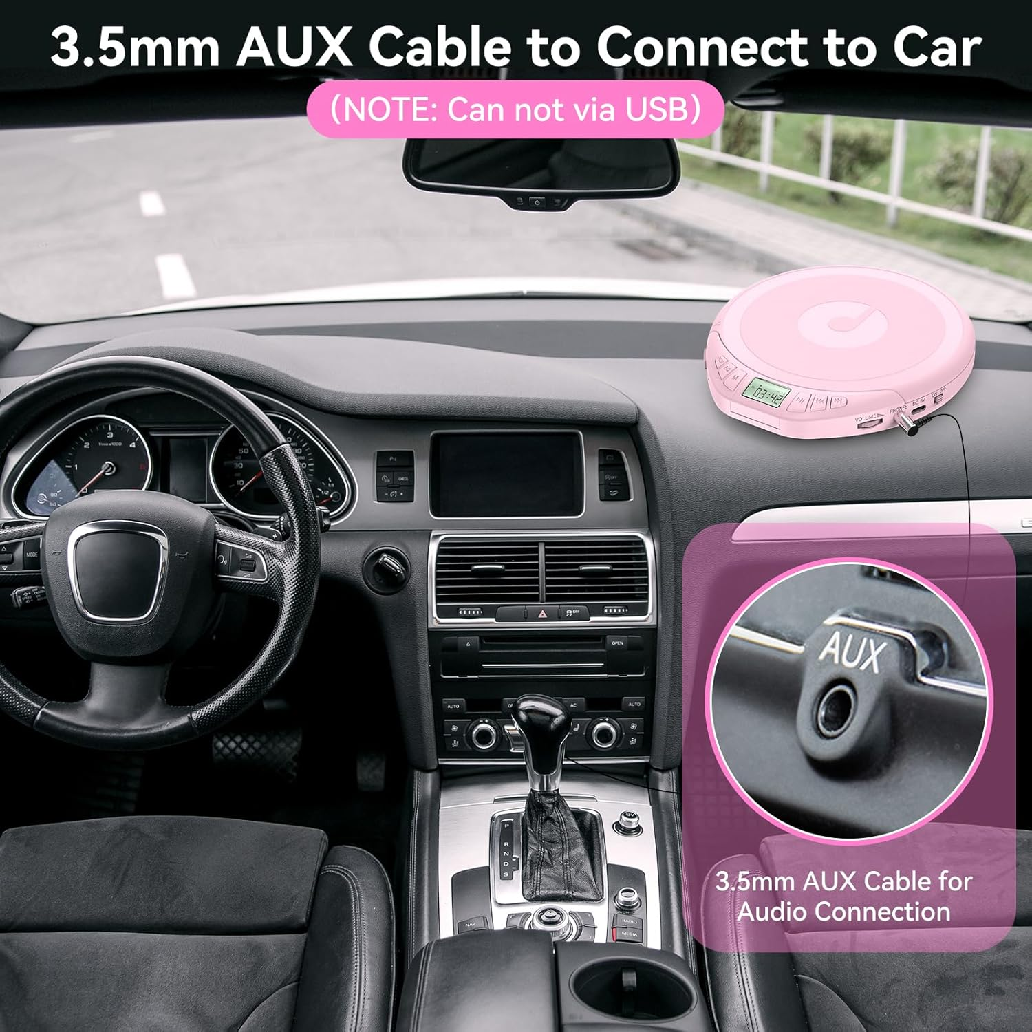 Ein rosafarbener CD-Player ist auf dem Armaturenbrett eines Autos platziert, neben einem AUX-Anschluss.