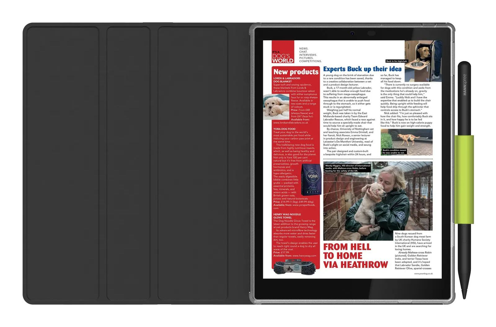 Una pagina di rivista per cani con nuovi prodotti e una storia su un Labrador salvato.