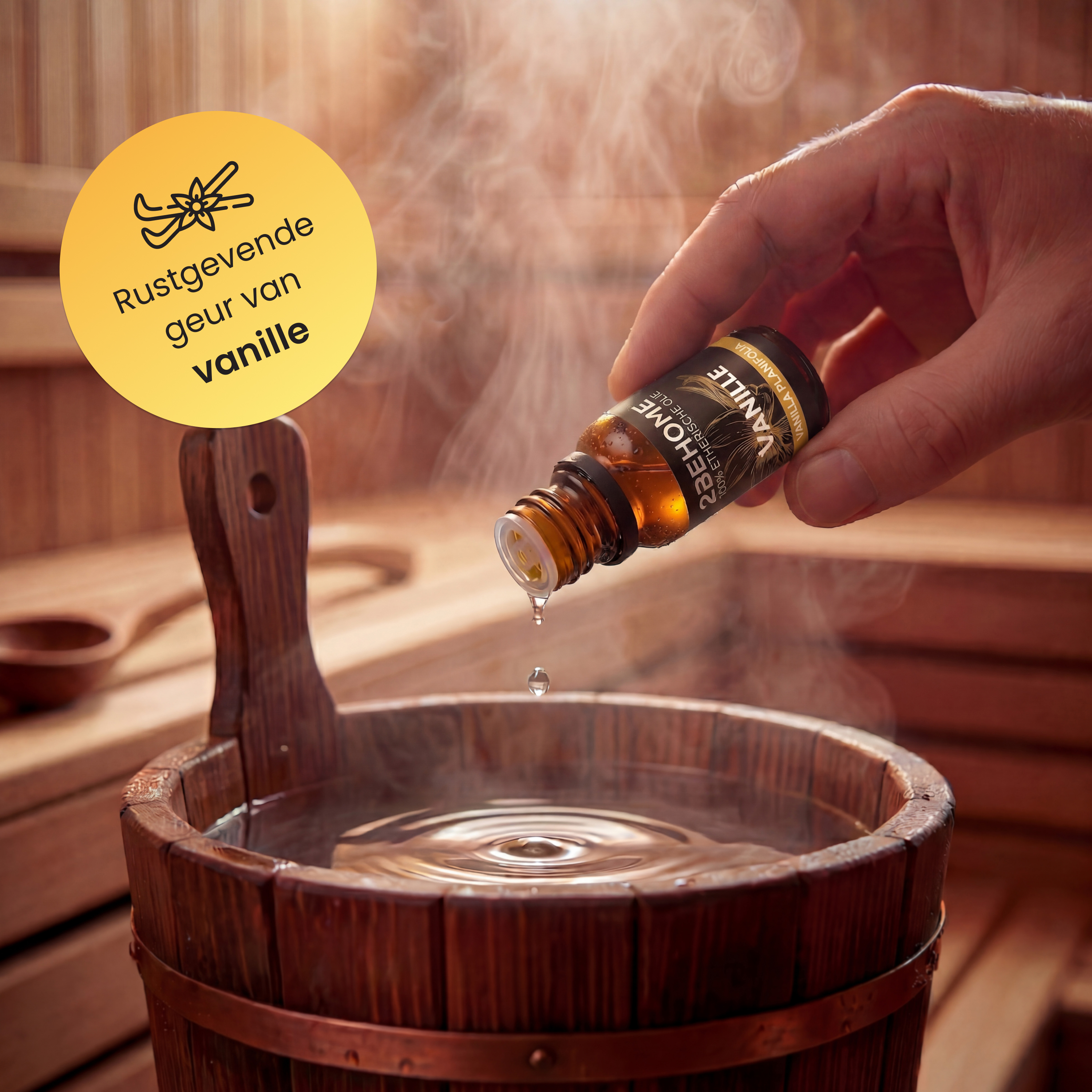 Tropfen ätherisches Öl in eine Sauna-Wanne voller Wasser. Dampf steigt auf.