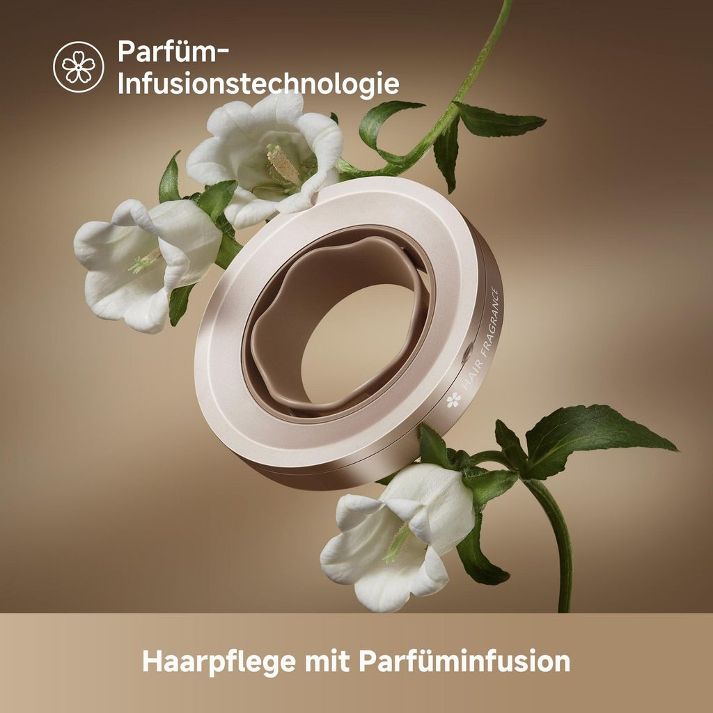 Ein roségoldener Diffusoraufsatz mit Blumen und Blättern auf beigefarbenem Hintergrund.