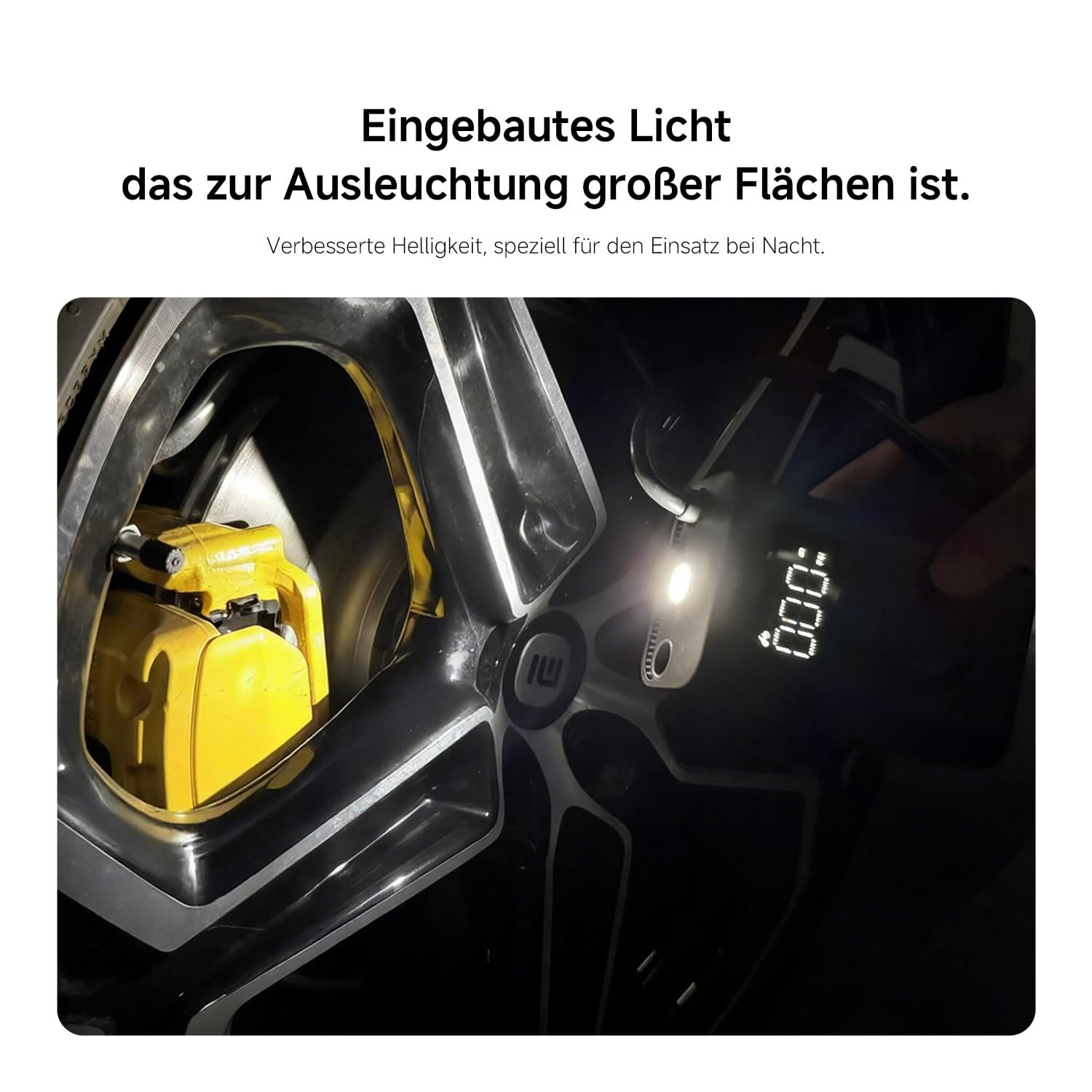 Ein tragbares Licht leuchtet auf ein gelbes Bremssattel und ein Rad.