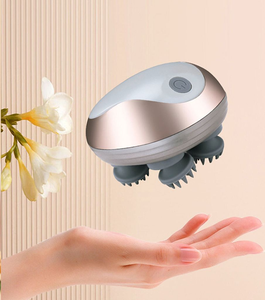 Ein Handmassagegerät mit vier Silikonköpfen schwebt über einer offenen Hand.