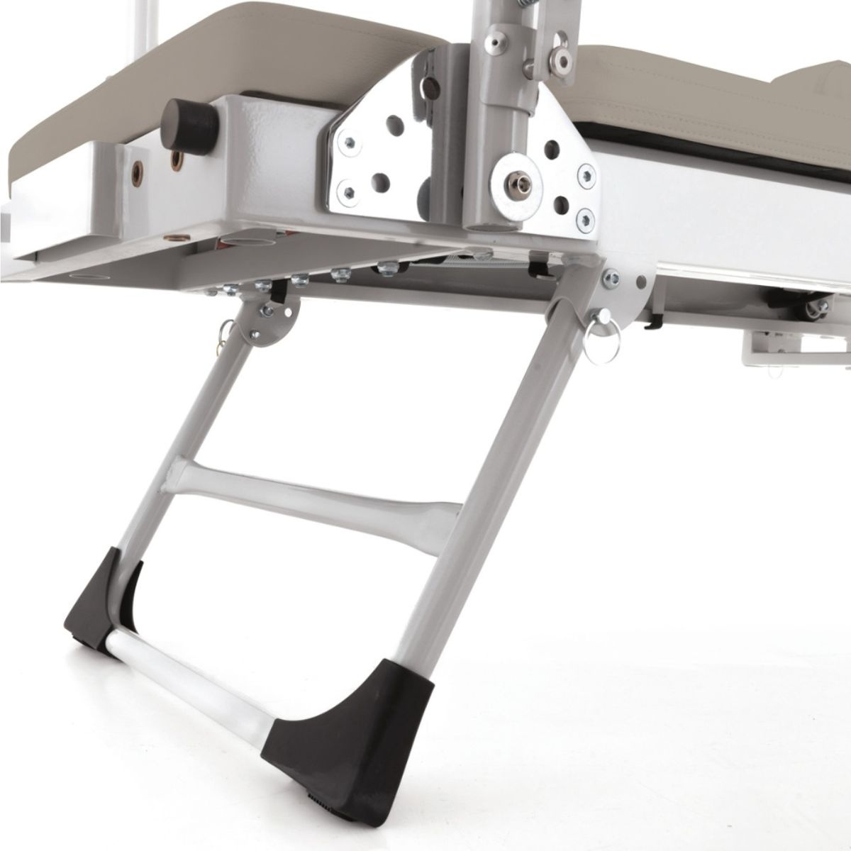Close-up of a reclining chair's frame and legs with silver metal components.