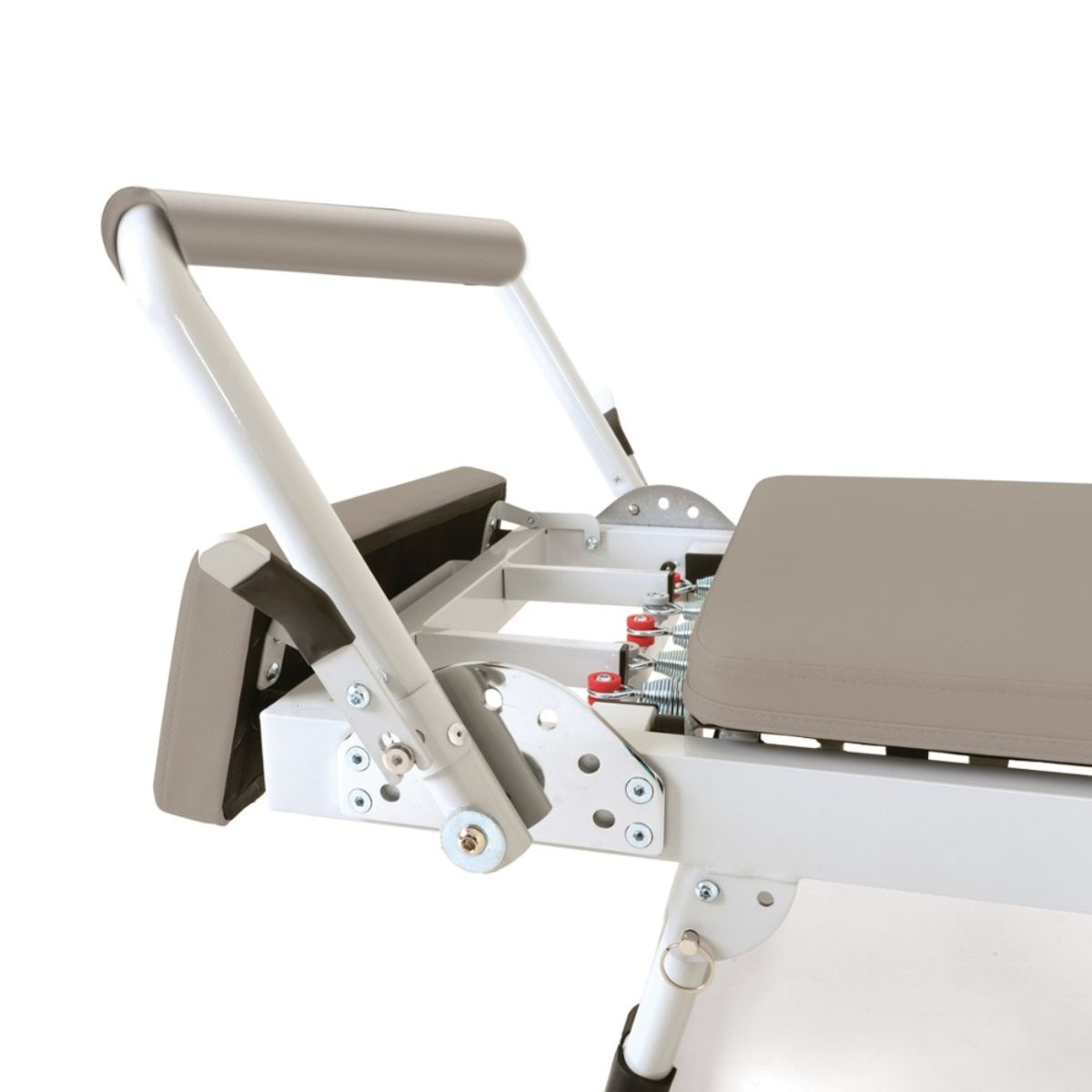 Pilates equipment with padded handles, a lying surface, and springs.