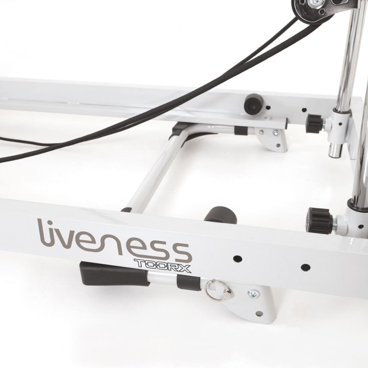 A white Liveness exercise machine with black cables and adjustment knobs.