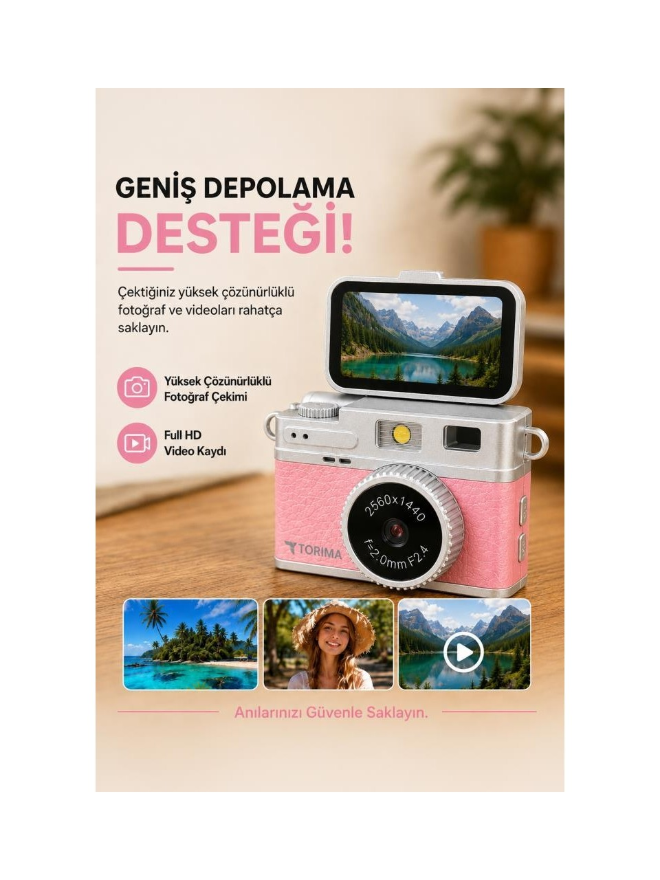 Dağ manzarasını gösteren bir ekrana sahip pembe dijital fotoğraf makinesi.