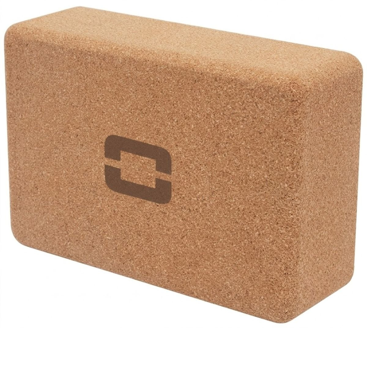 A cork-colored yoga block with a dark logo on its side.