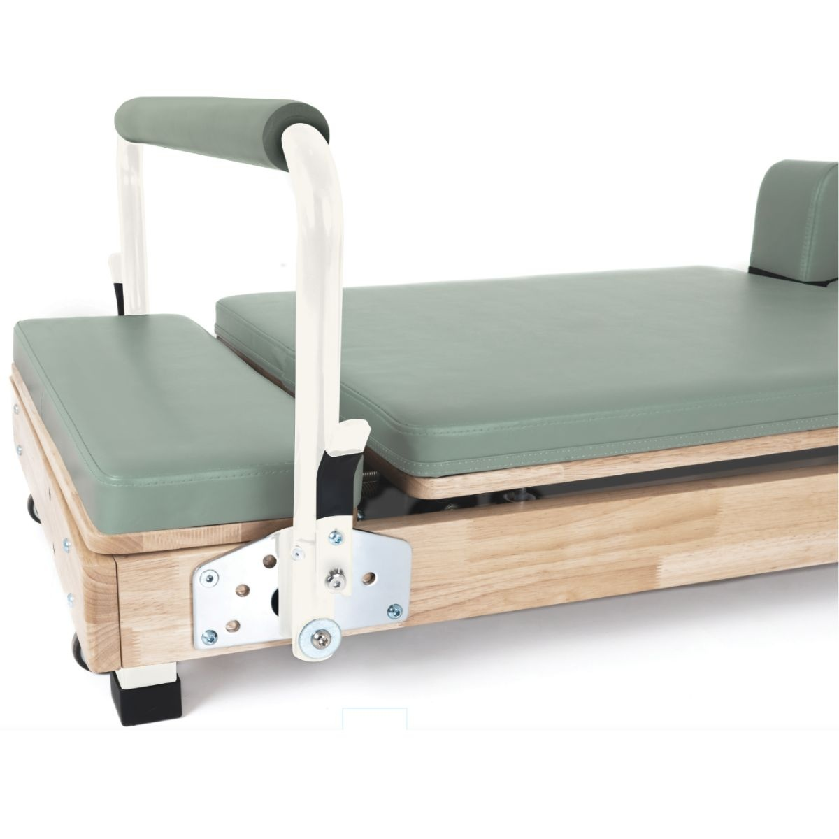A Pilates reformer with padded seats and metal handles on a wooden frame.