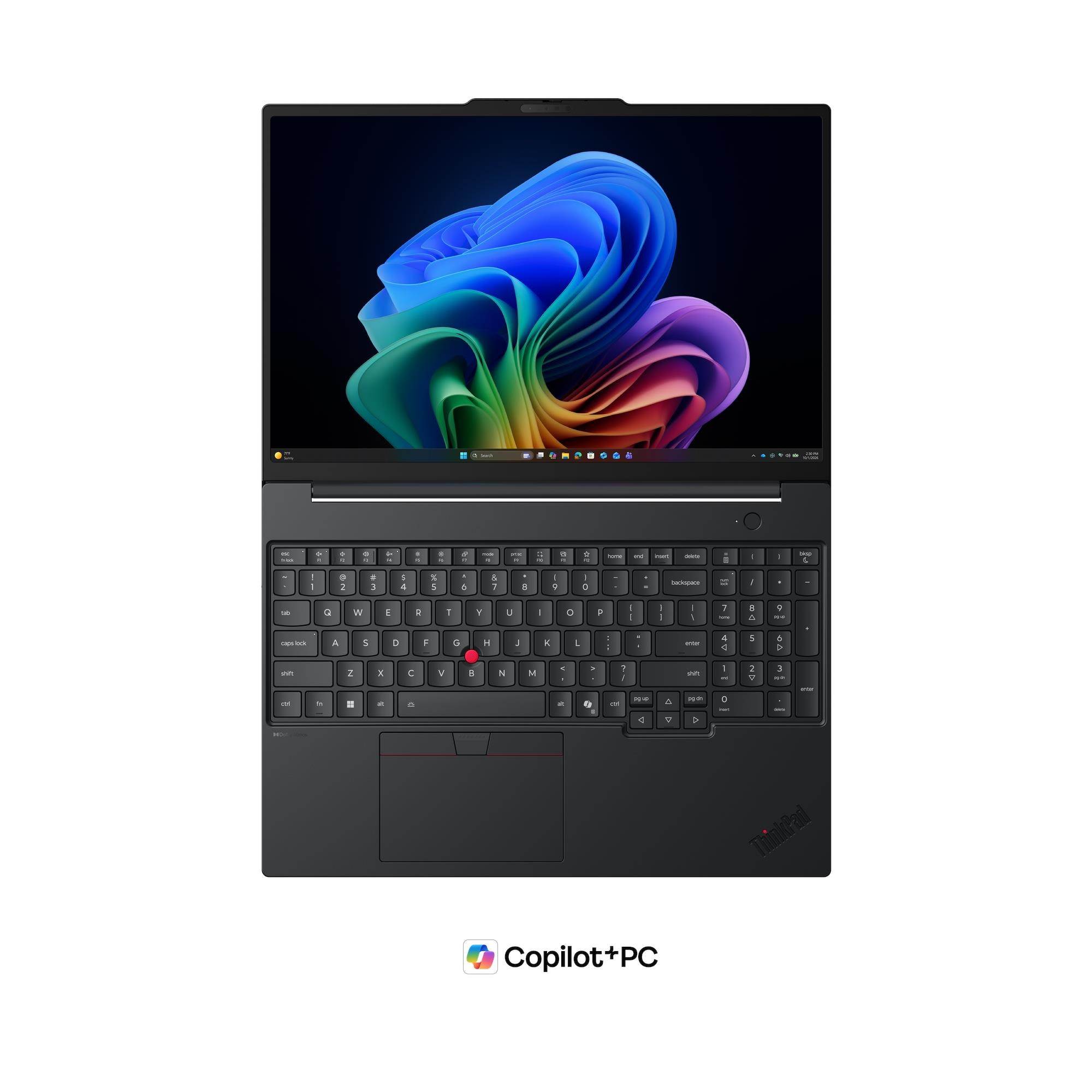 Un laptop chiuso che mostra uno sfondo del desktop colorato e una tastiera.