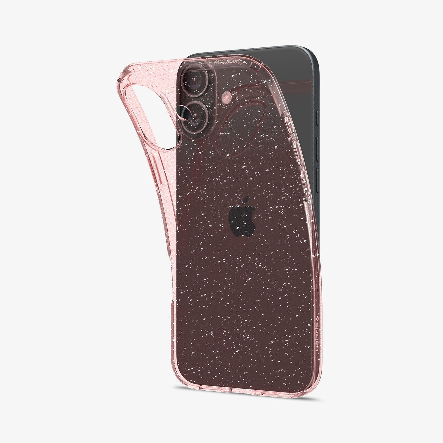 Una cover rosa glitterata per telefono giace su un iPhone scuro.
