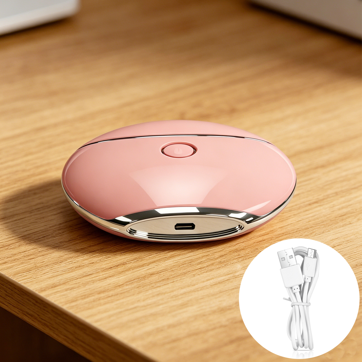 Un tagliaunghie rosa con porta USB-C e cavo di ricarica su una scrivania di legno.