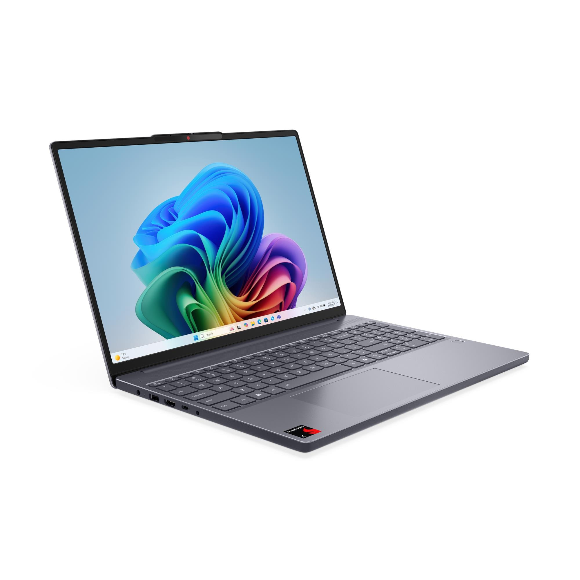 Un laptop grigio mostrato con uno sfondo colorato sul suo schermo.