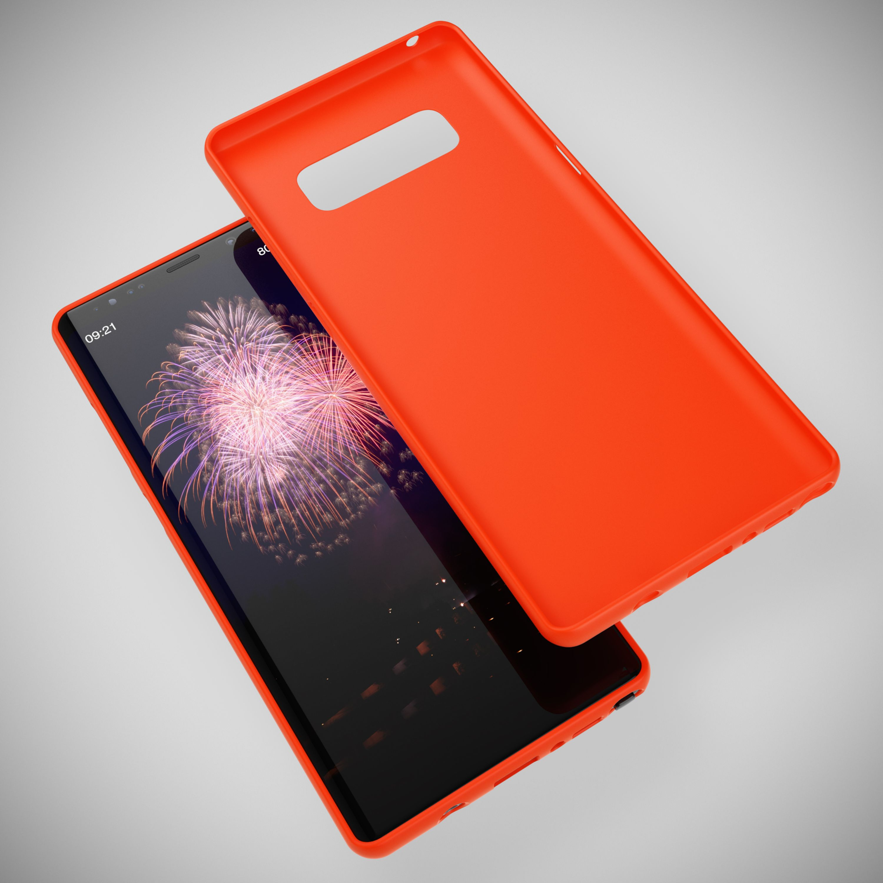 Ein orangefarner Handyhülle liegt neben einem Smartphone mit einem Feuerwerksbildschirm.