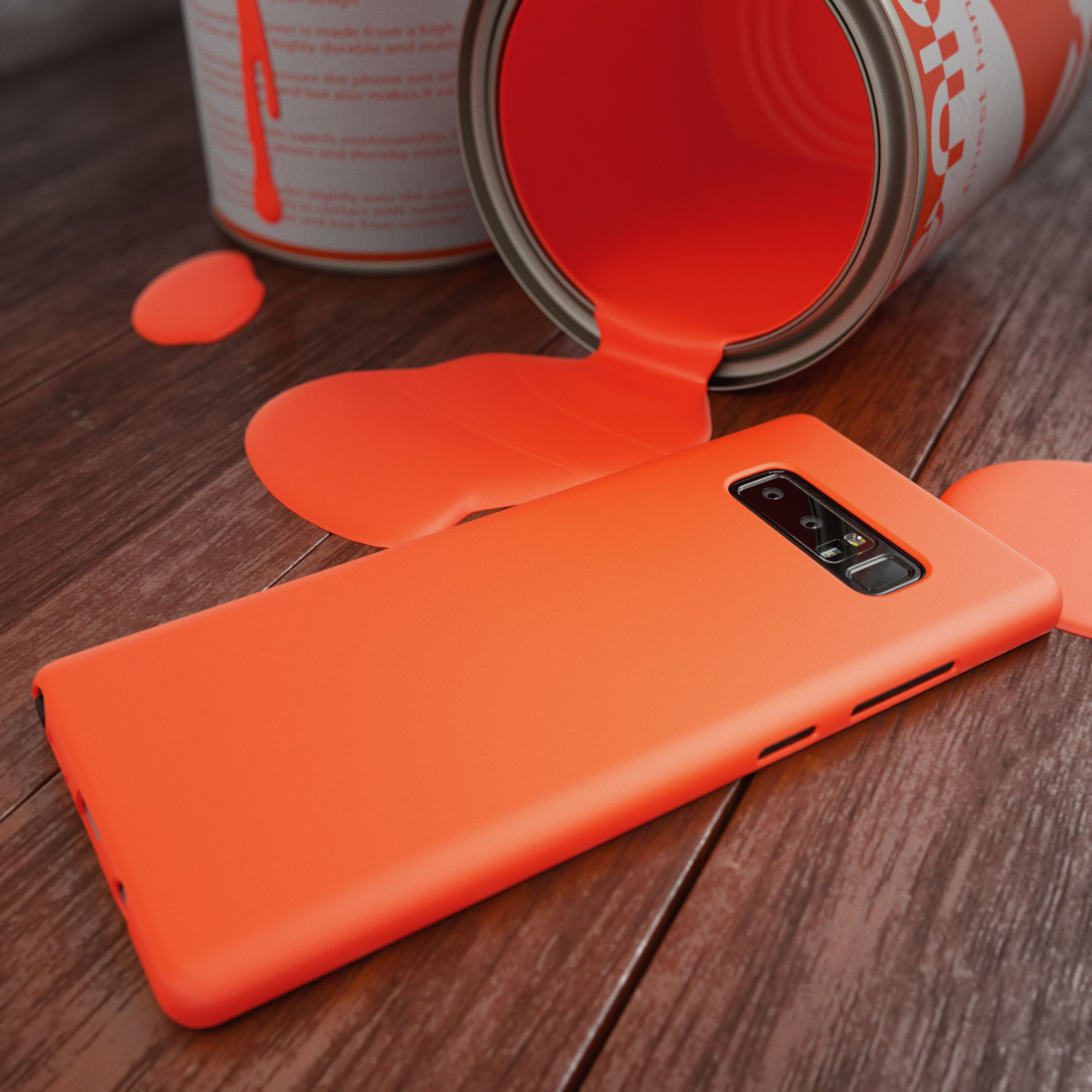 Orange Farbe fließt aus einer Dose auf ein Smartphone auf Holzboden.