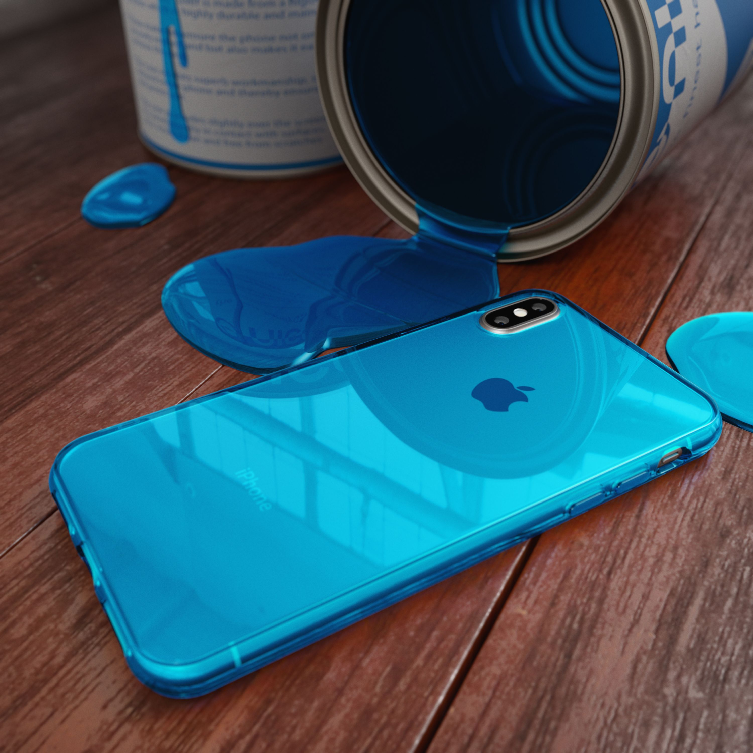 Ein blaues iPhone liegt auf einer Holzoberfläche neben einer verschütteten Dose blauer Farbe.