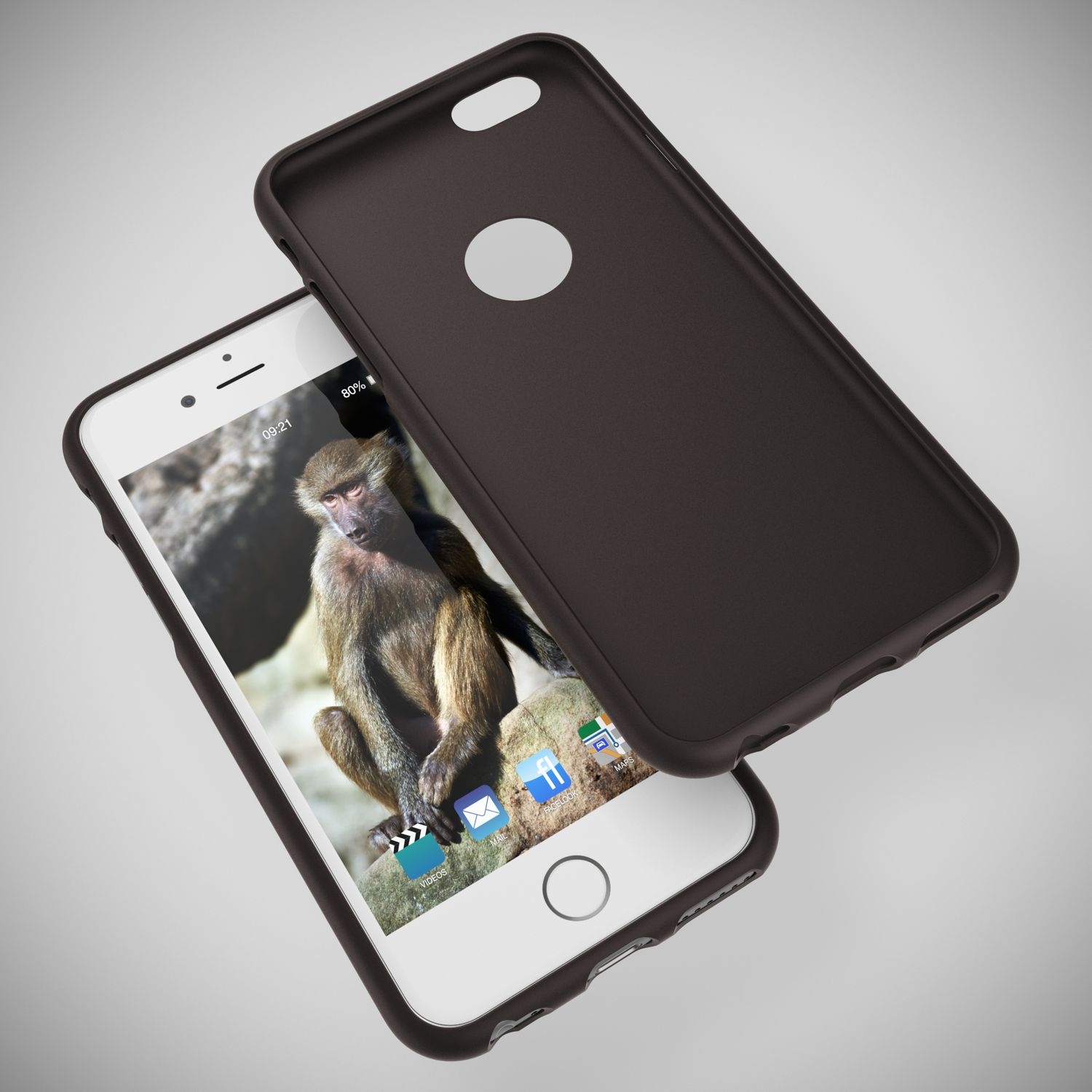 Ein dunkler Handyhülle liegt neben einem Smartphone mit Affenbildschirm.