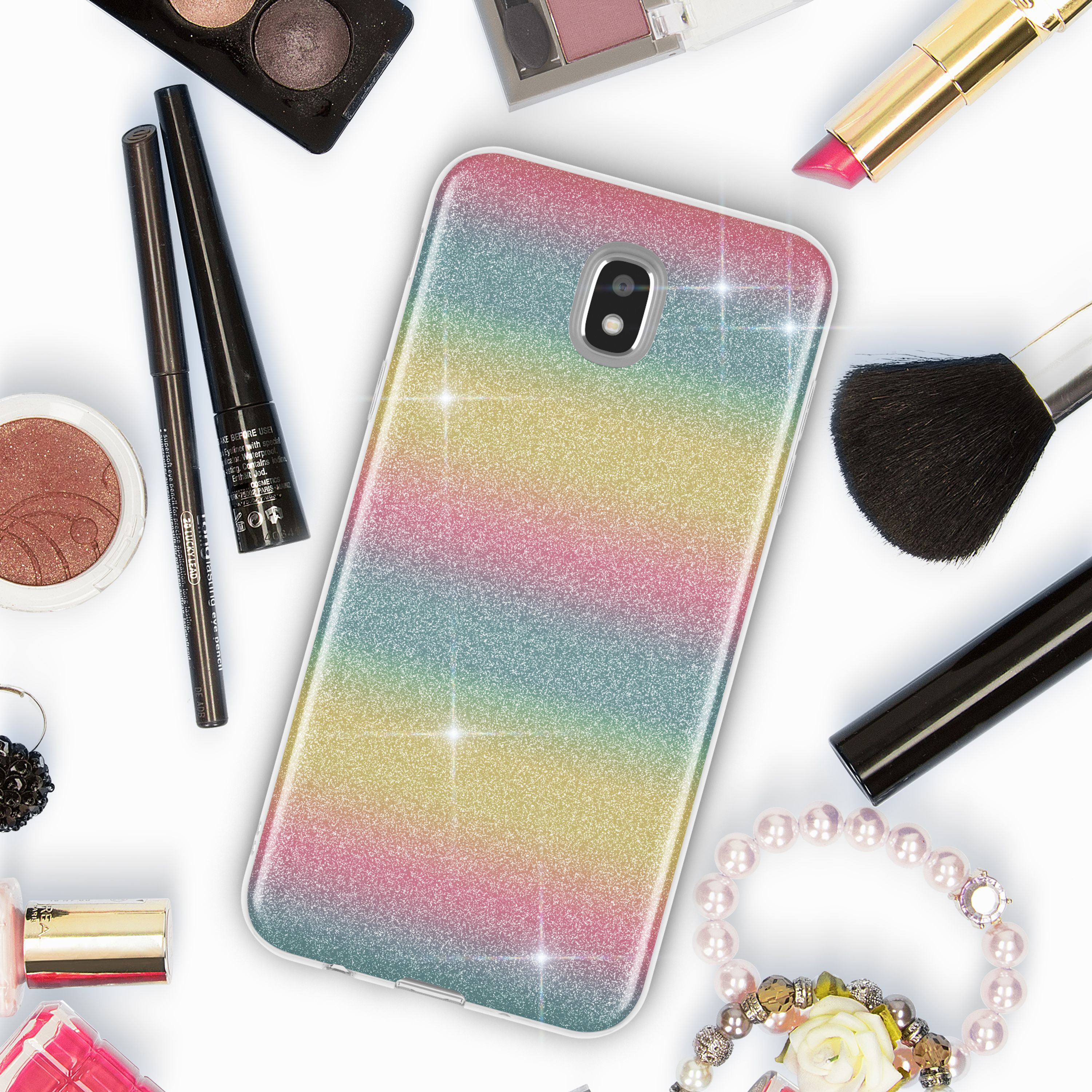 Handyhülle mit Regenbogen-Glitzer-Design, umgeben von Make-up und Schmuck.