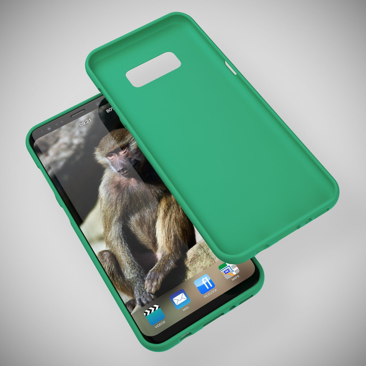 Ein grüner Handyhülle liegt neben einem Smartphone mit einem Affenbildschirm.