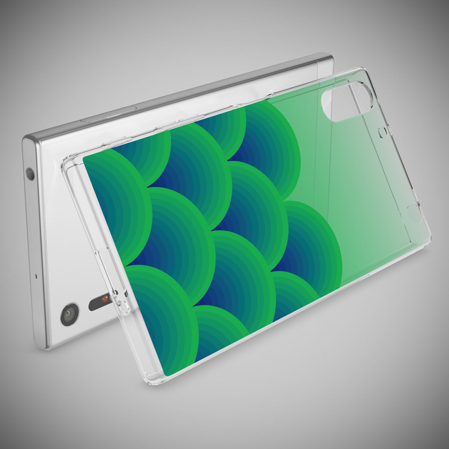 Ein transparentes Handyhülle mit grünen und blauen Kreisen auf einem silbernen Handy.