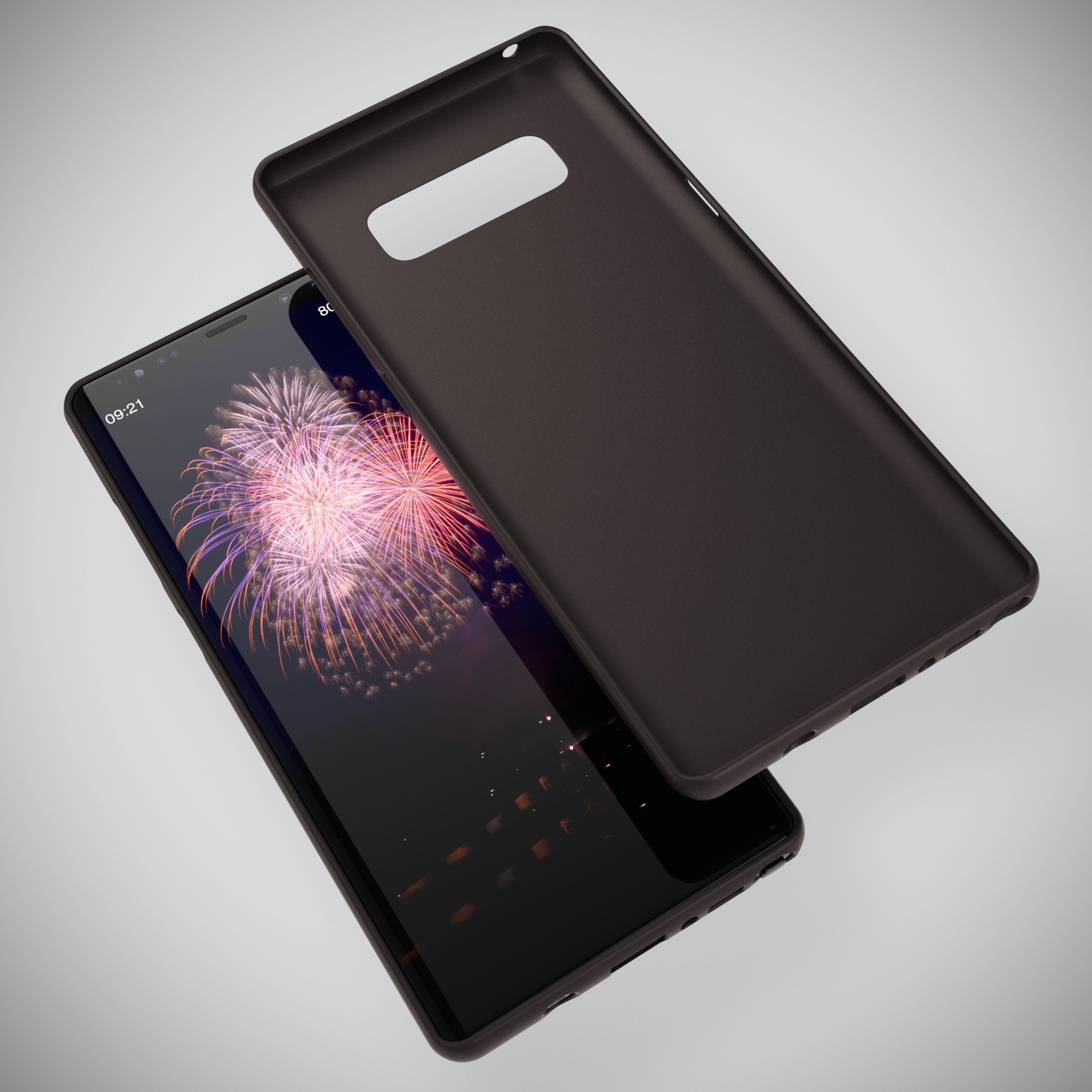 Eine dunkle Handyhülle liegt neben einem Smartphone mit Feuerwerksanzeige.