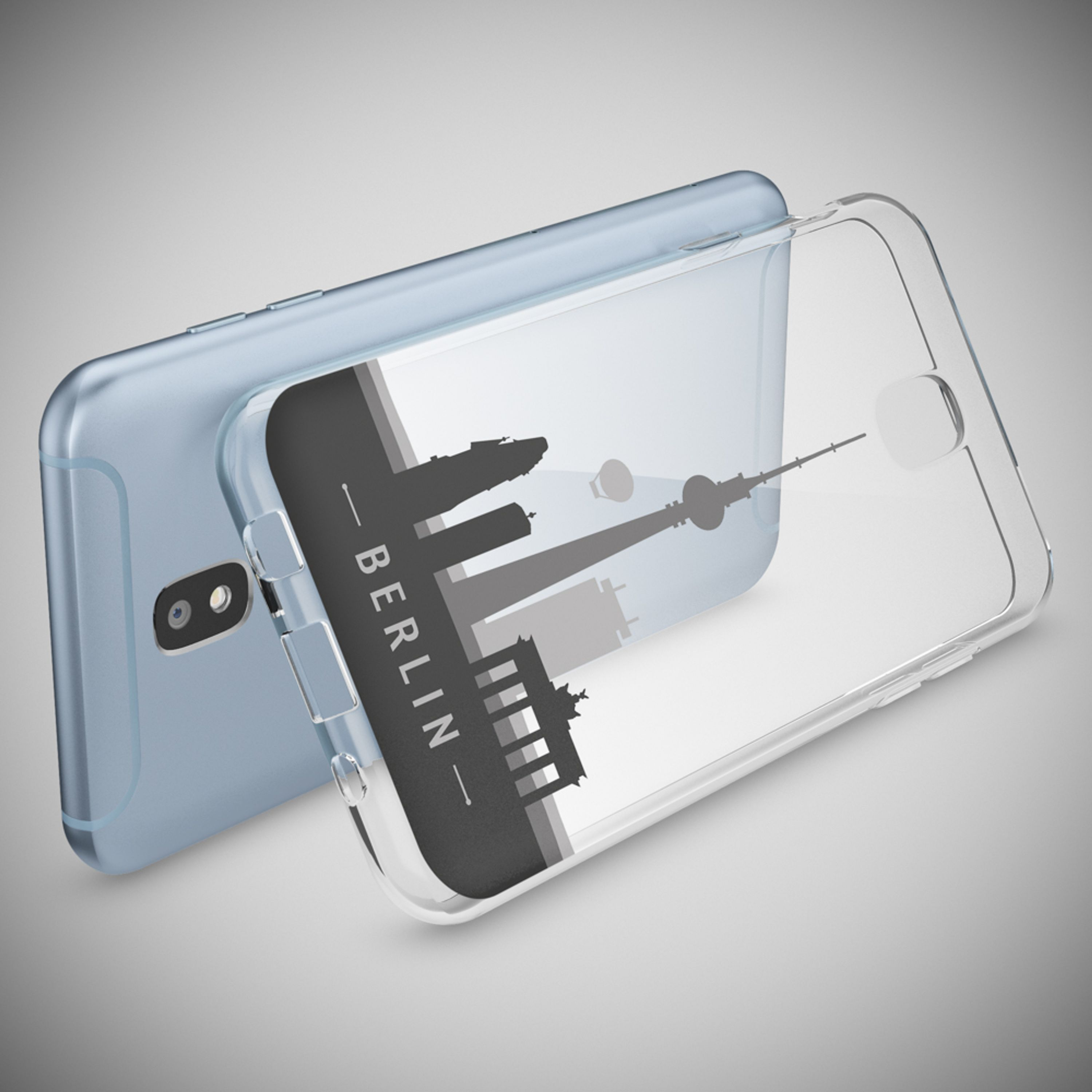 Ein blaues Smartphone liegt neben einer transparenten Hülle mit Berliner Skyline.