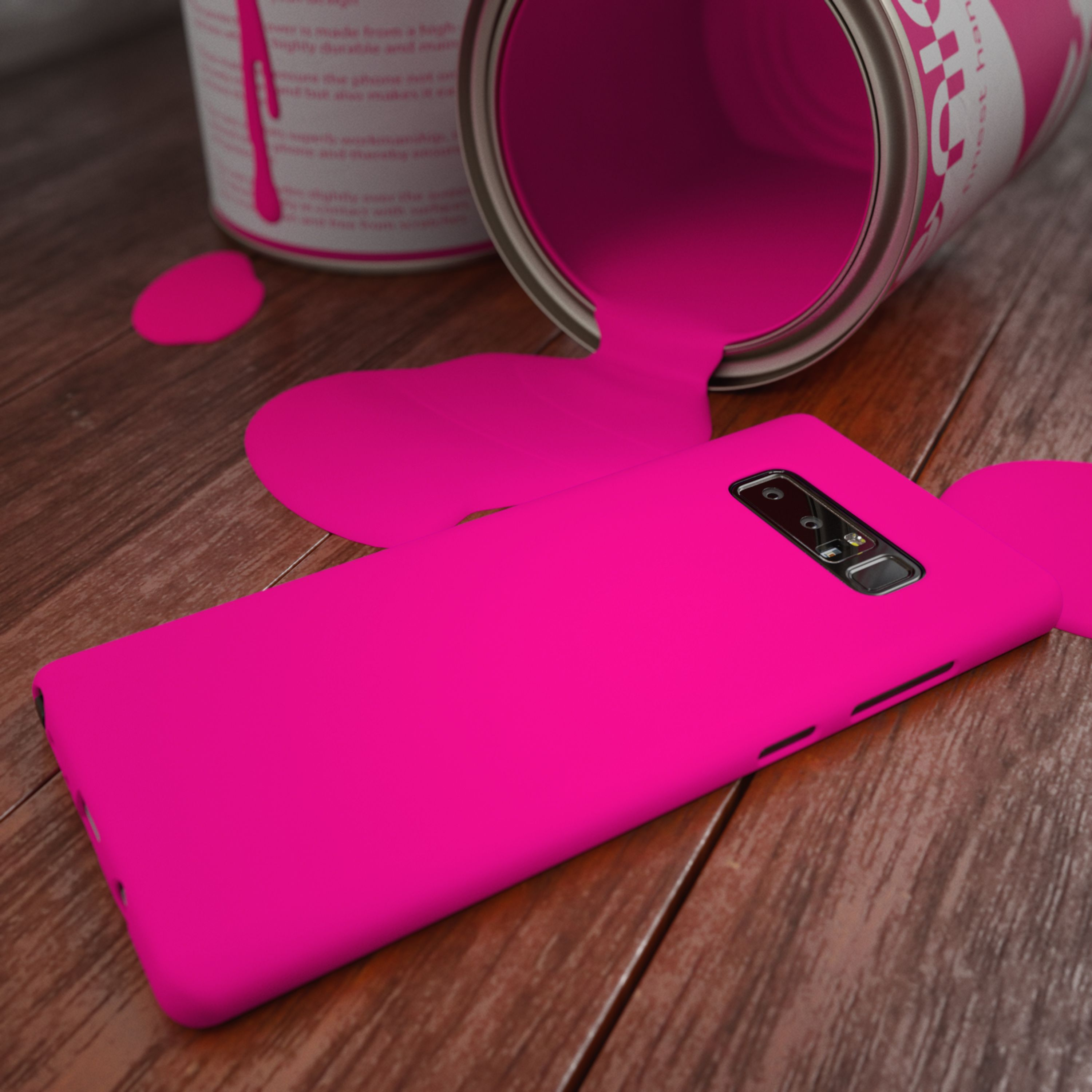 Ein auf einer Holzoberfläche liegendes Smartphone, das mit pinker Farbe bedeckt ist.