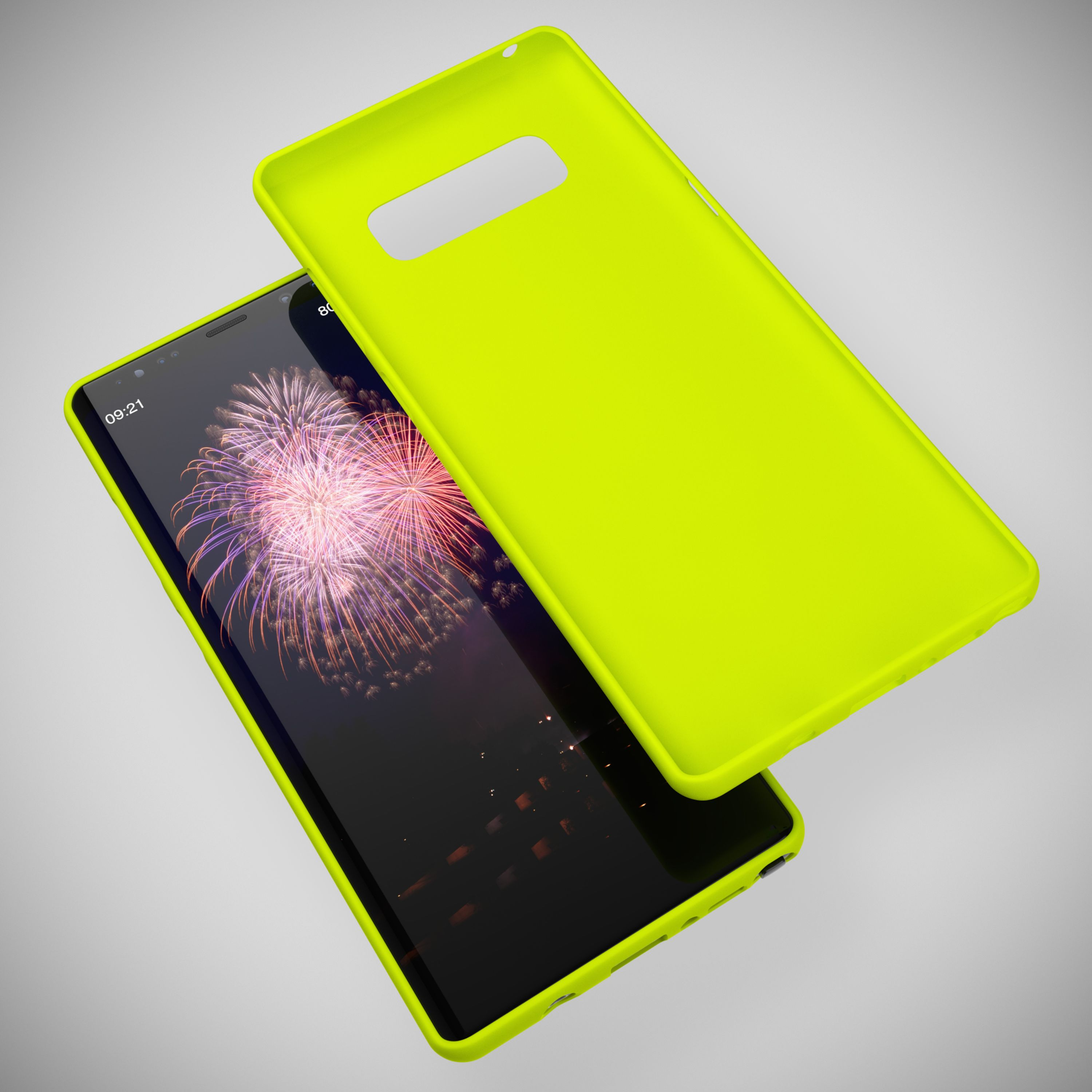 Ein gelbes Handycover liegt neben einem Smartphone mit Feuerwerk-Hintergrund.