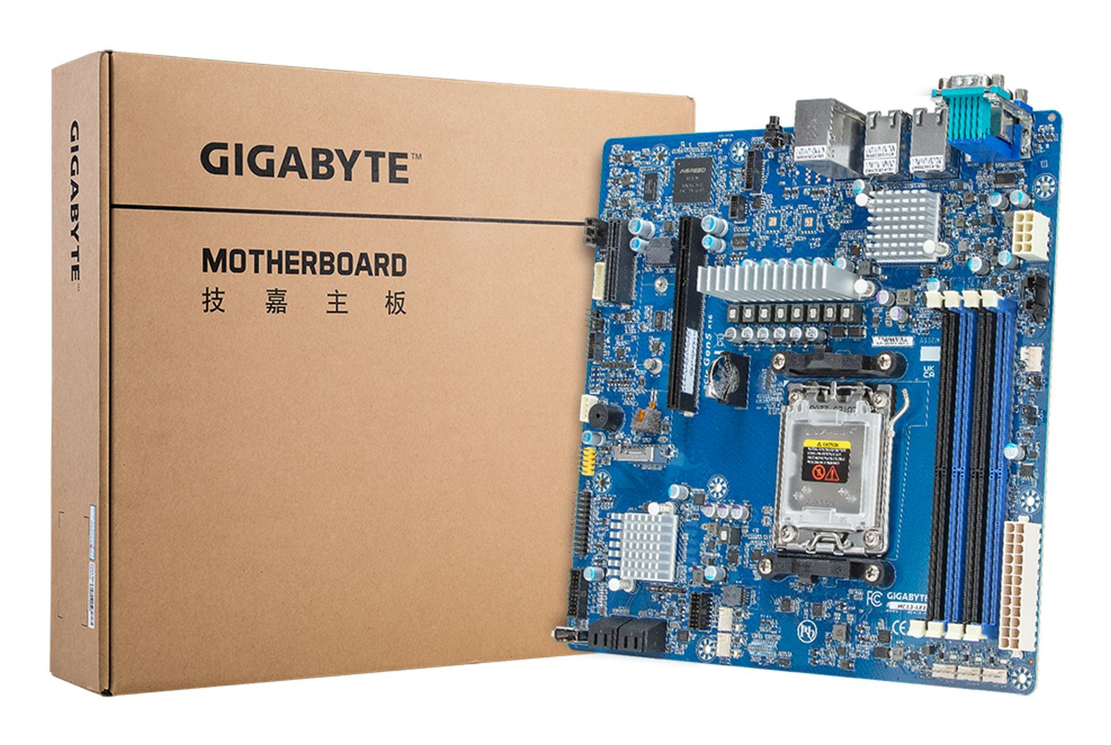 Niebieska płyta główna Gigabyte obok brązowego pudełka z logo Gigabyte.