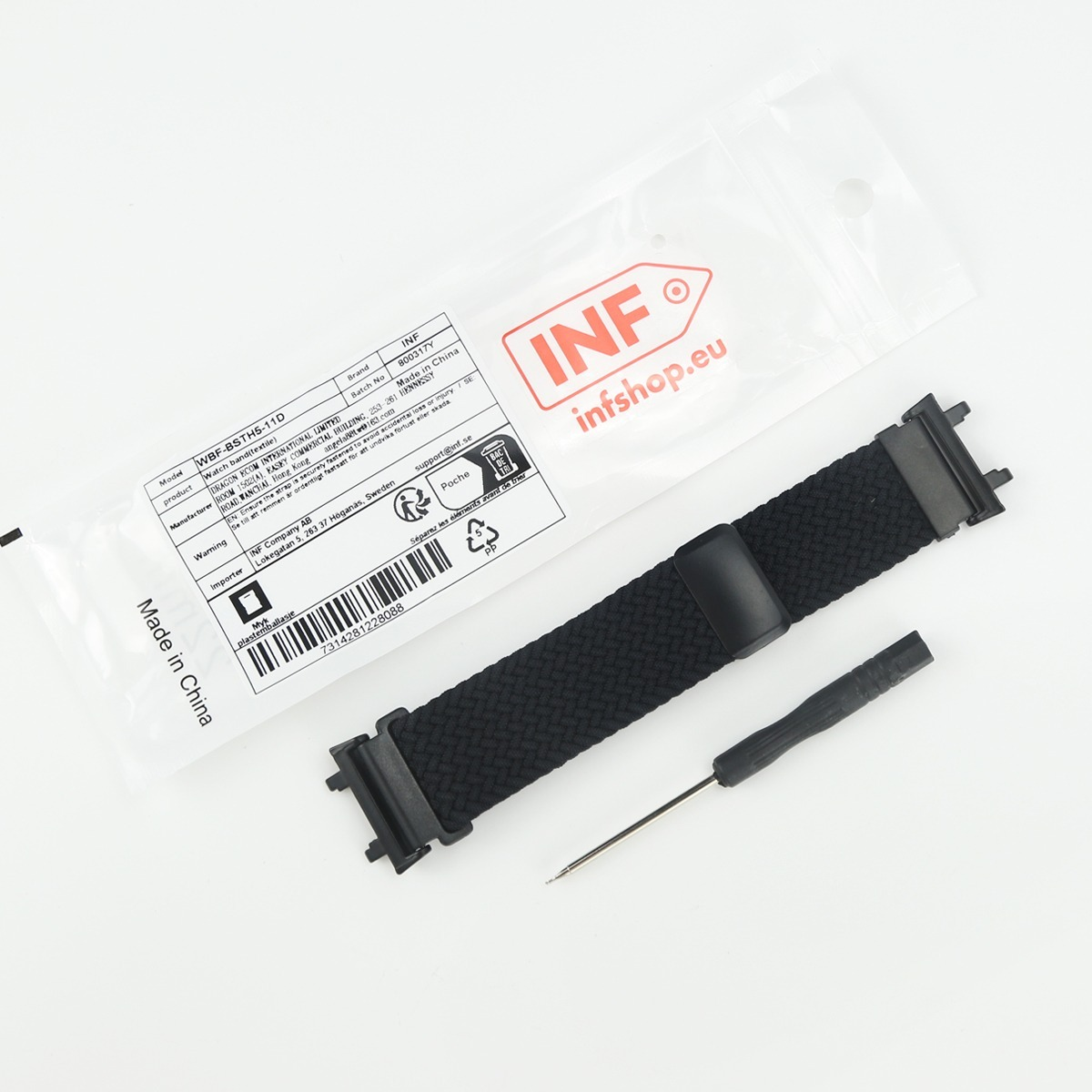 Schwarzes Textil-Uhrenarmband mit Werkzeug und Verpackung.