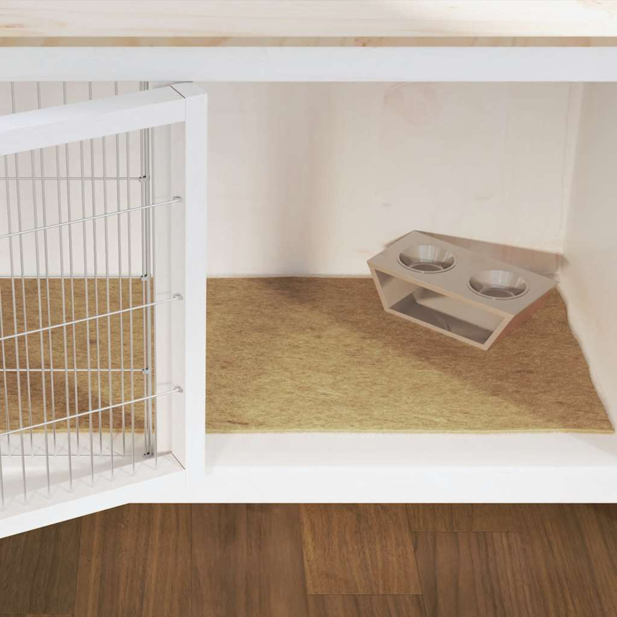 Una gabbia bianca con mangiatoia a due ciotole su un tappeto beige all'interno.