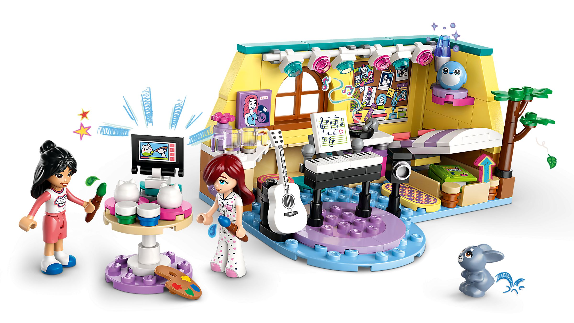 Zwei Mädchen, eine Gitarre, Klavier und Bühne in einem bunten Raum. Eine Spielzeugmaus ist in der Nähe.