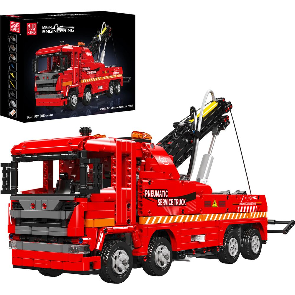Ein roter Spielzeug-Abschleppwagen mit Kran und "Pneumatic Service Truck" Aufschrift.
