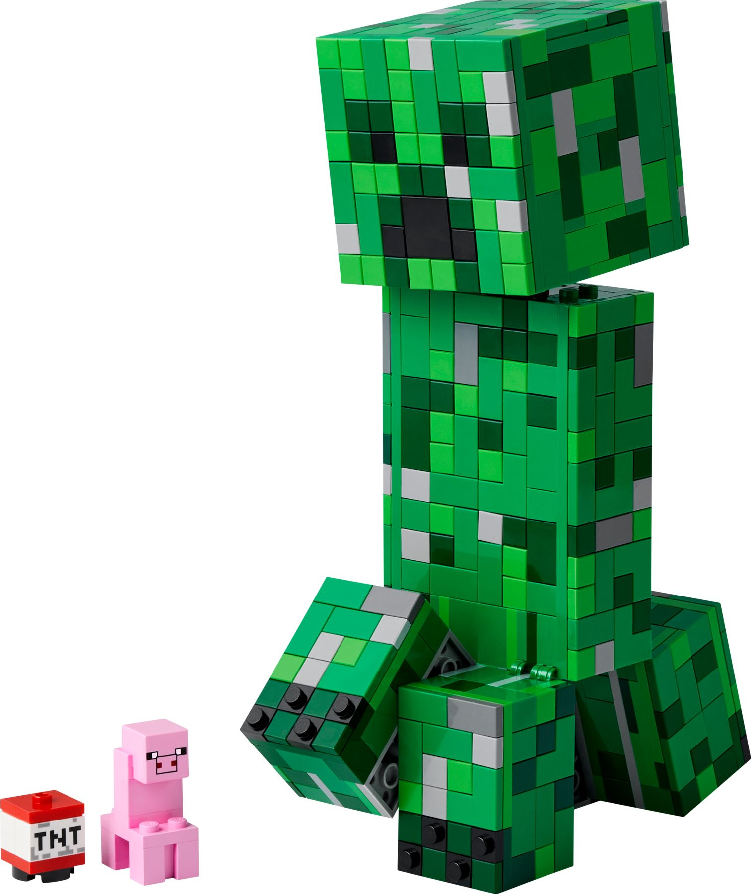 Una figura verde di Lego Minecraft Creeper con TNT e una figura di maiale rosa.