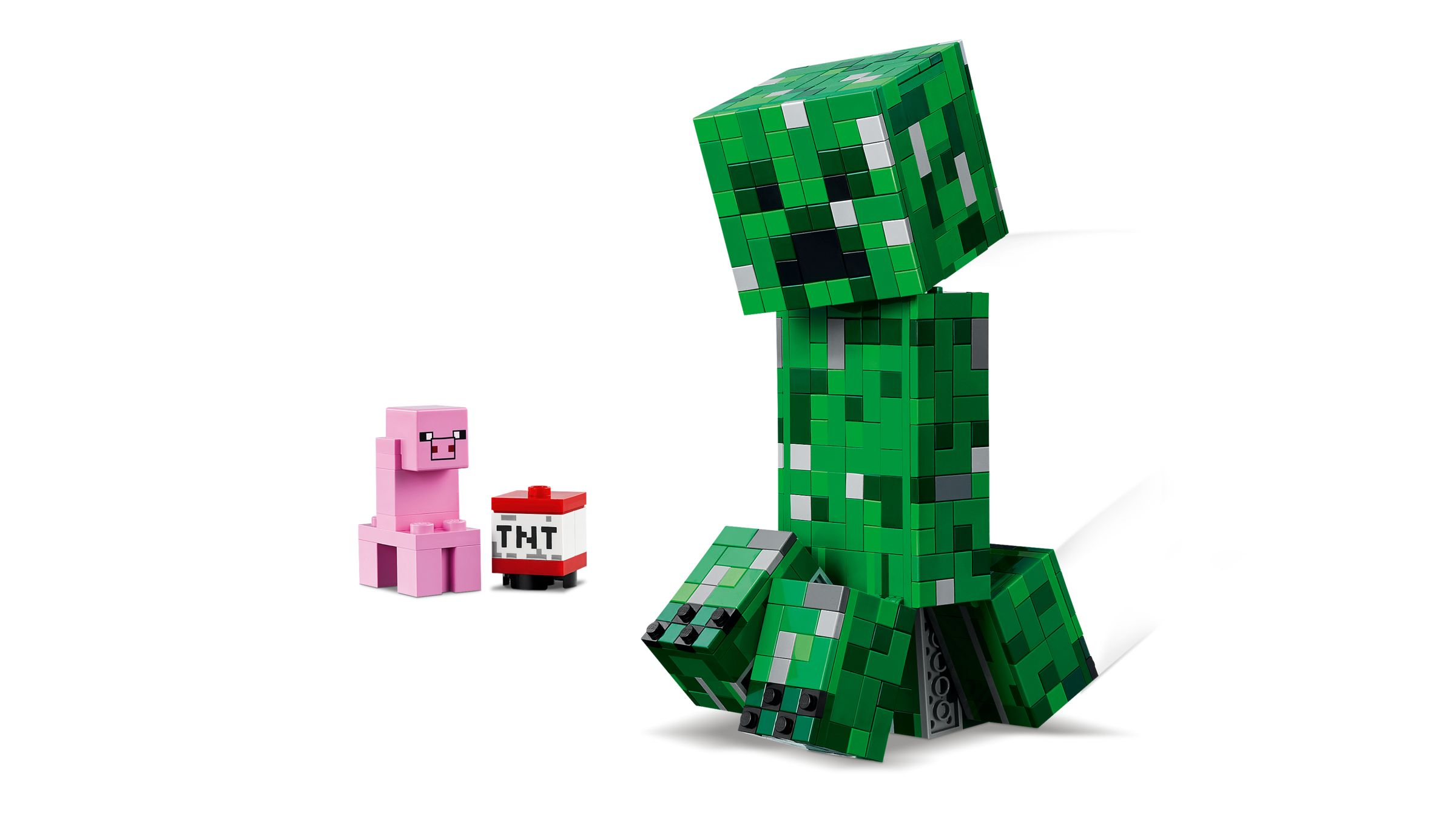 Figure Minecraft Creeper, maiale e blocco TNT su sfondo bianco.