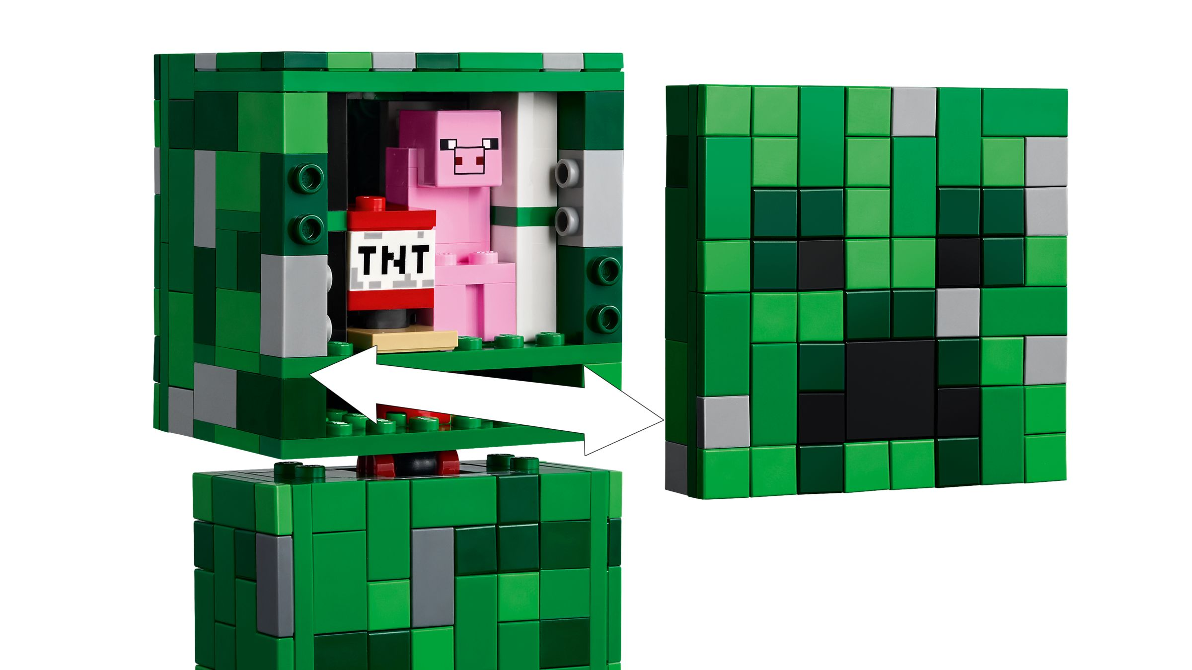Un personaggio rosa di Minecraft siede accanto al TNT in un cubo Lego verde.